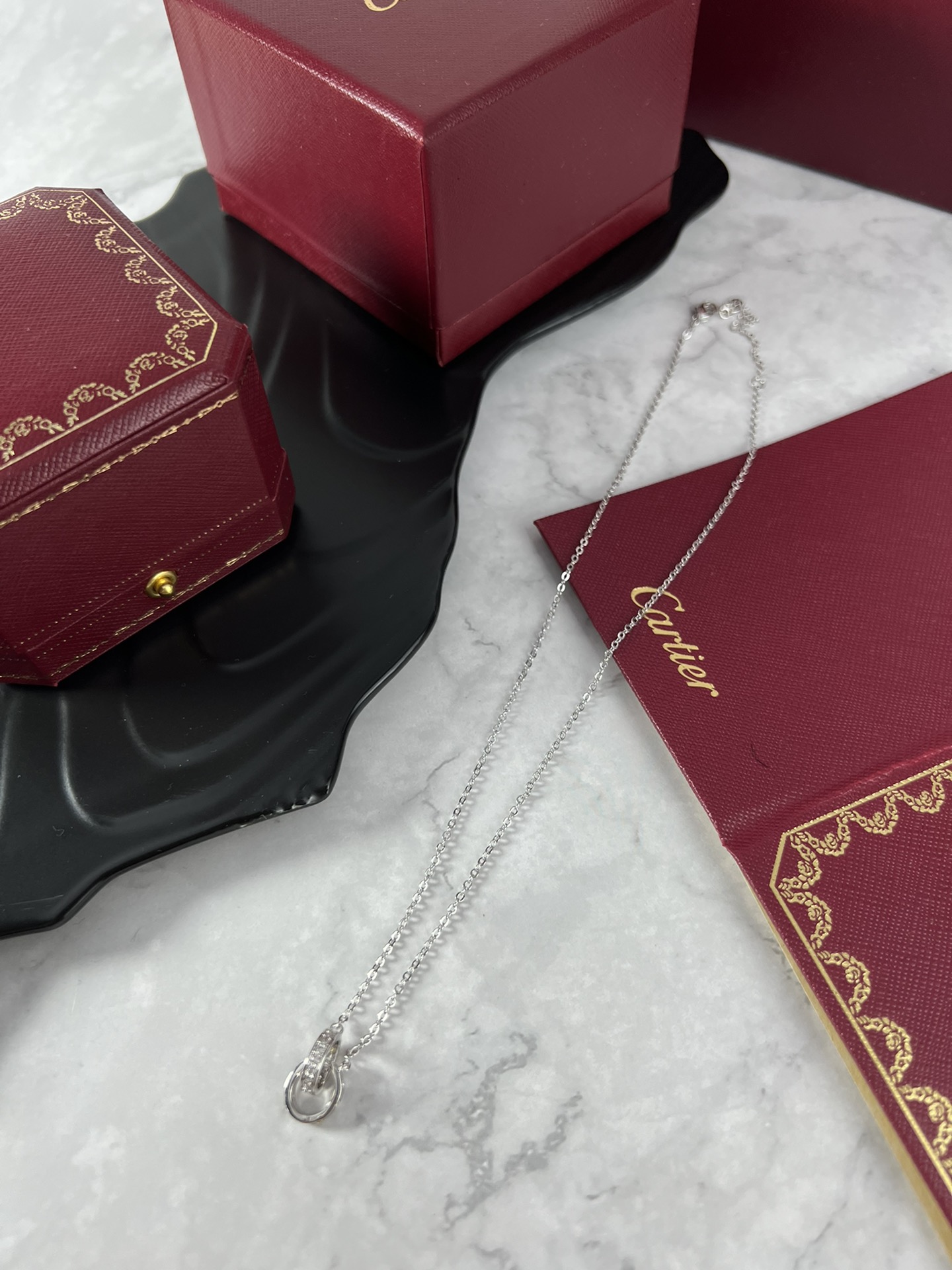 Cartier Love necklace silver-toned white gold with clear diamonds and yellow gold accent stones 42cm