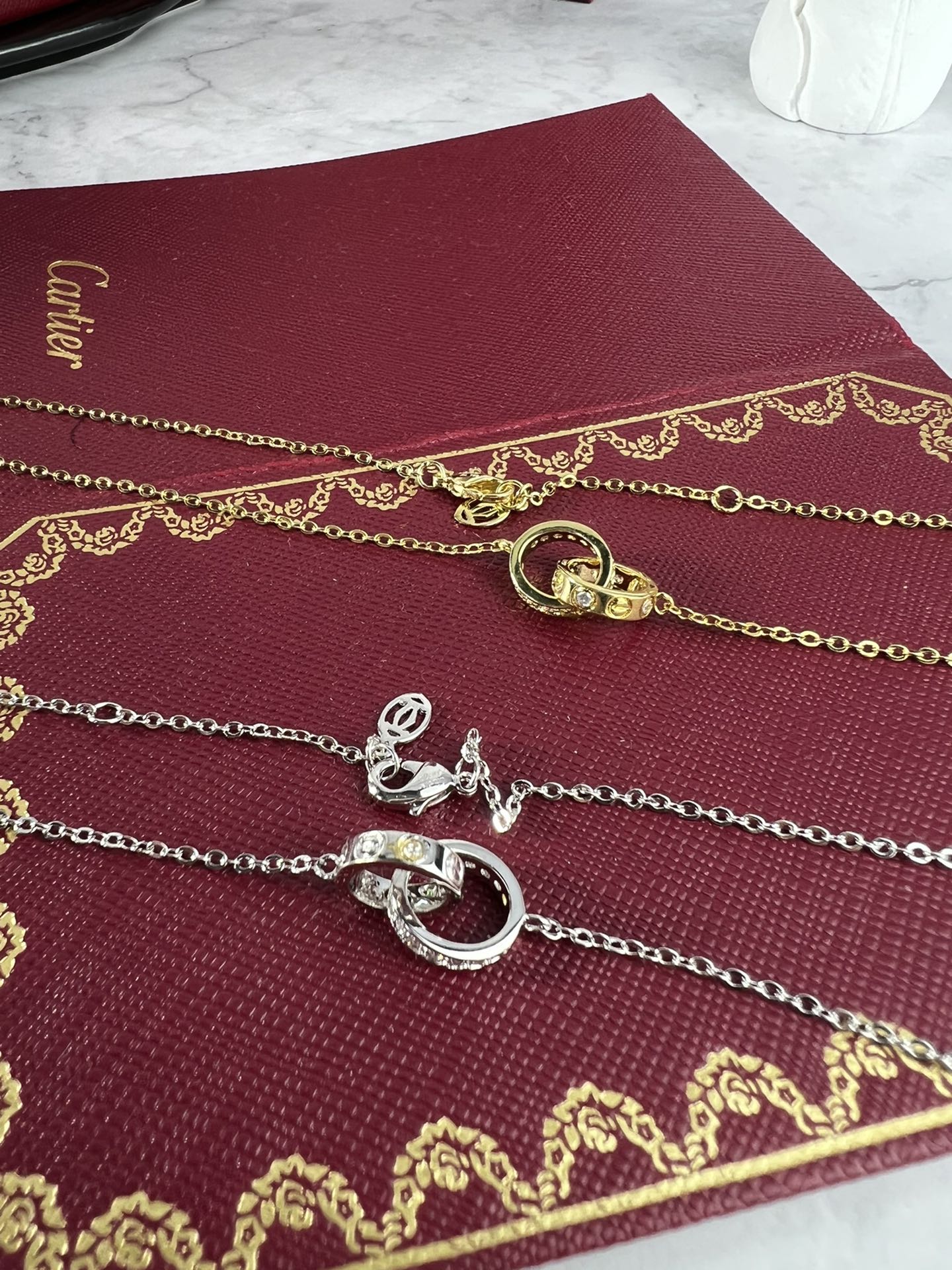 Cartier Love necklace silver-toned white gold with clear diamonds and yellow gold accent stones 42cm
