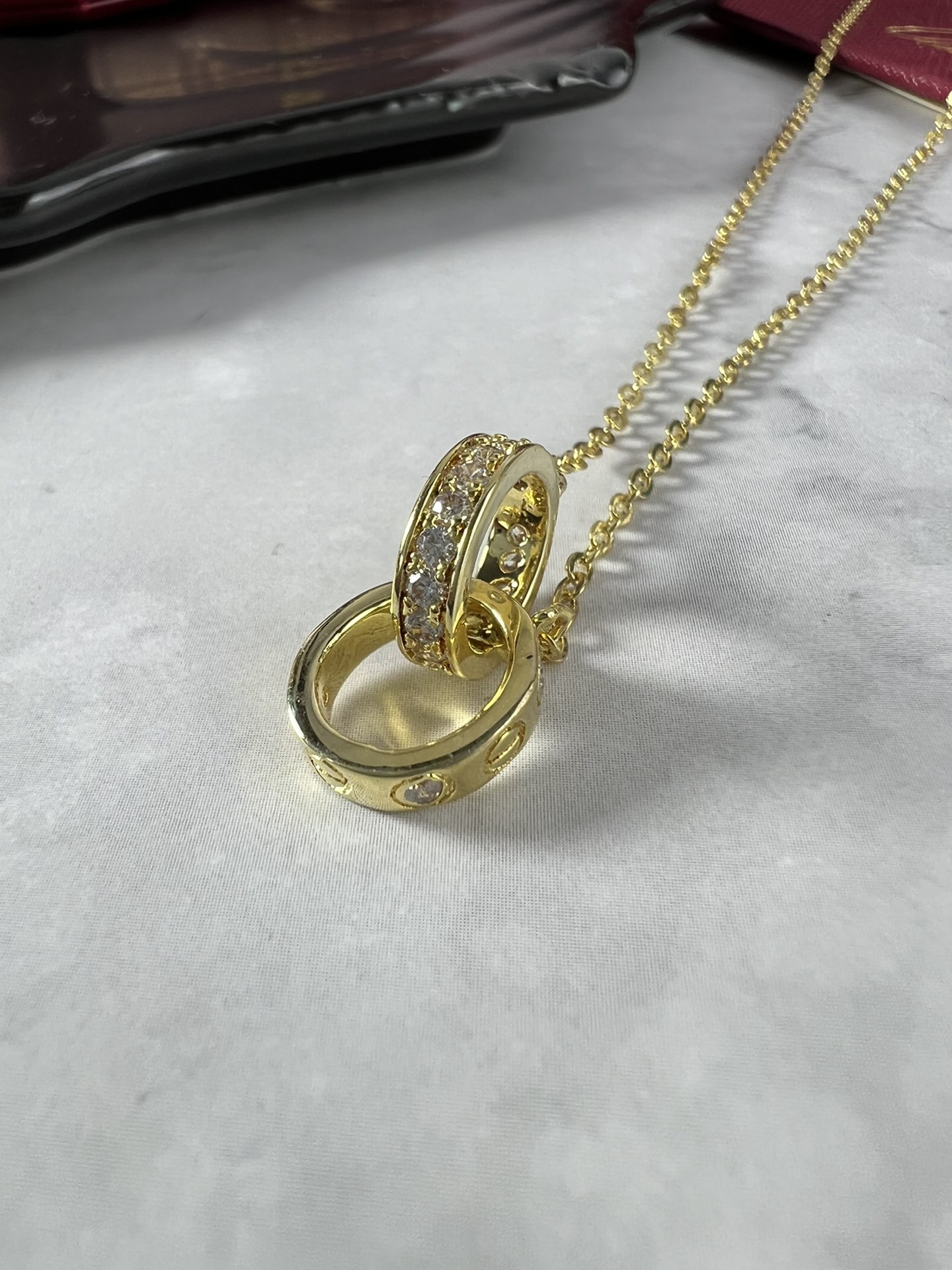 Cartier Love necklace silver-toned white gold with clear diamonds and yellow gold accent stones 42cm