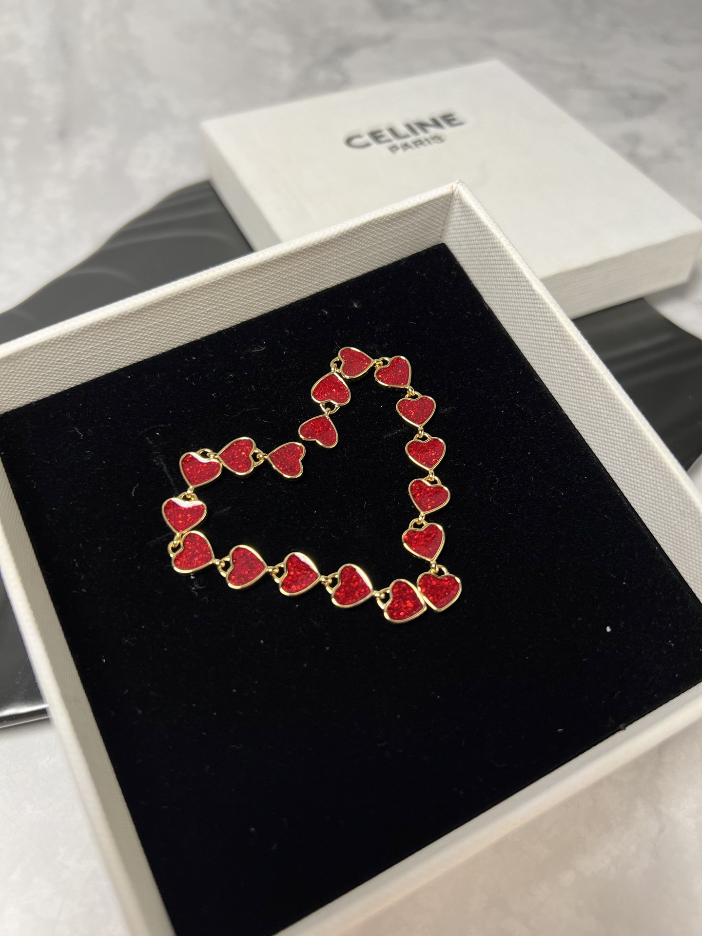 Celine YHED055 Glitter Heart Drop earrings gold-tone metal with glittery deep red enamel heart accents 6 5cm drop length