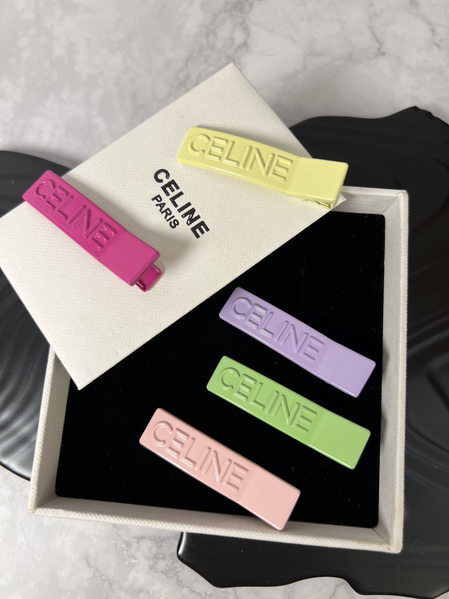 Celine YHFJ045 Embossed Logo Hair Clip Set brooch Enamel in fuchsia light pink light green light purple pale yellow with embossed matching-tone Celine logo 6cm per
