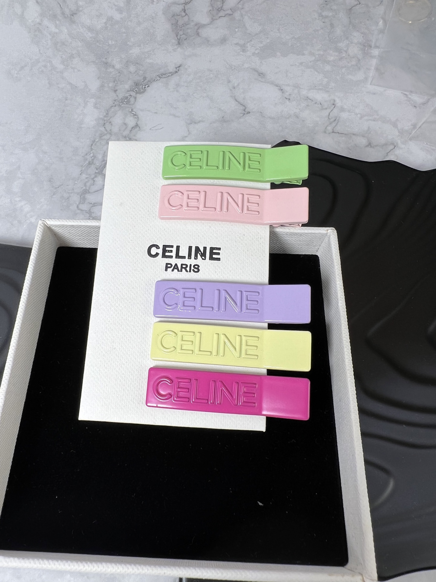Celine YHFJ045 Embossed Logo Hair Clip Set brooch Enamel in fuchsia light pink light green light purple pale yellow with embossed matching-tone Celine logo 6cm per
