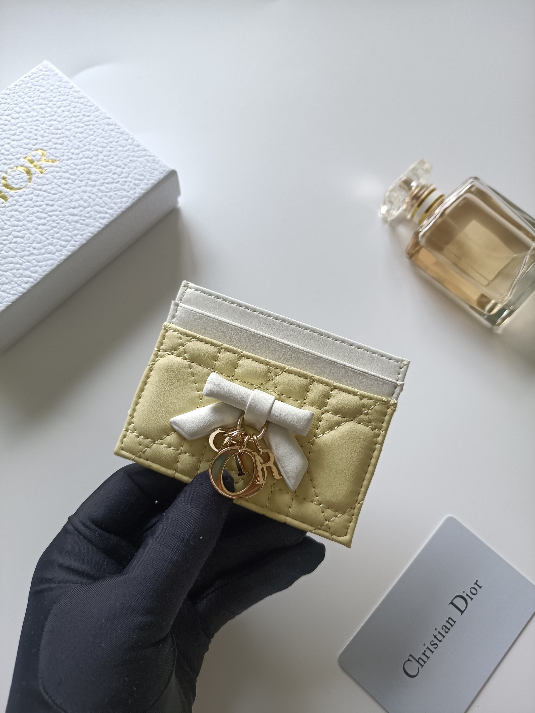 Christian Dior Lady Dior Bow Charm Card Holder brooch Pale yellow lambskin leather with white trim white fabric bow rose gold-tone metal hardware 10 5 8 0 5cm