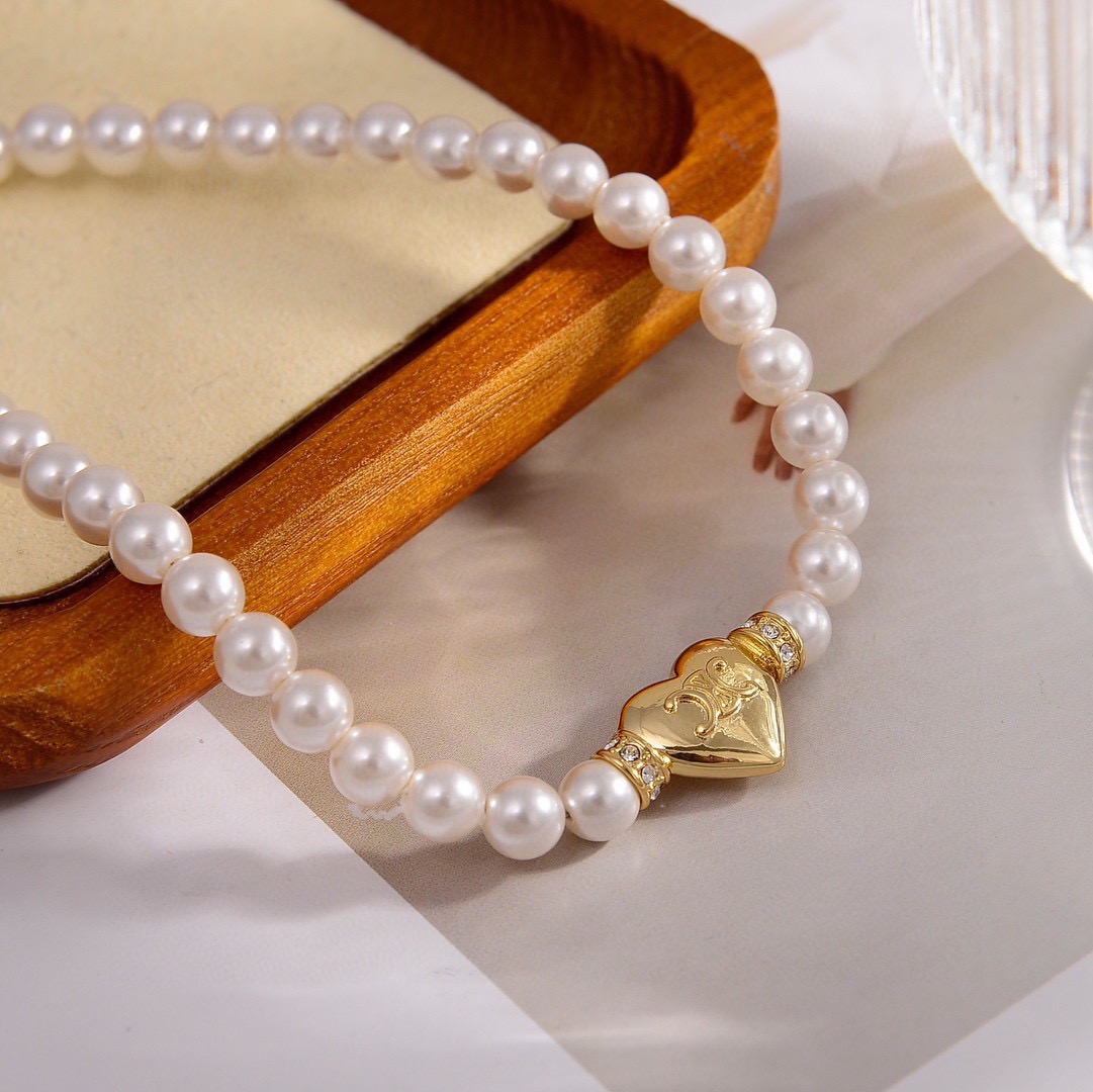 Celine PRECIOUS Heart Pearl bracelet gold-tone metal white pearl clear crystal accents 18cm with 5cm extender chain