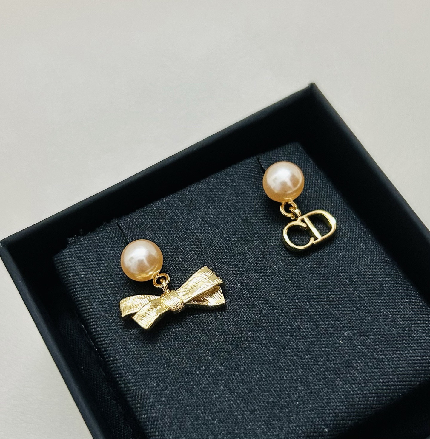 Dior CD Bow earrings Gold-tone metal with champagne pink pearl resin beads One Size