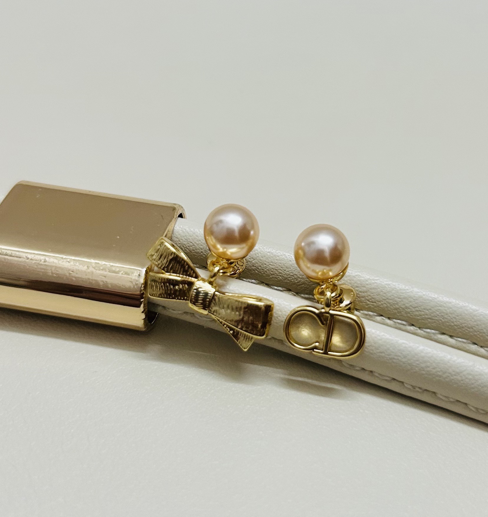 Dior CD Bow earrings Gold-tone metal with champagne pink pearl resin beads One Size