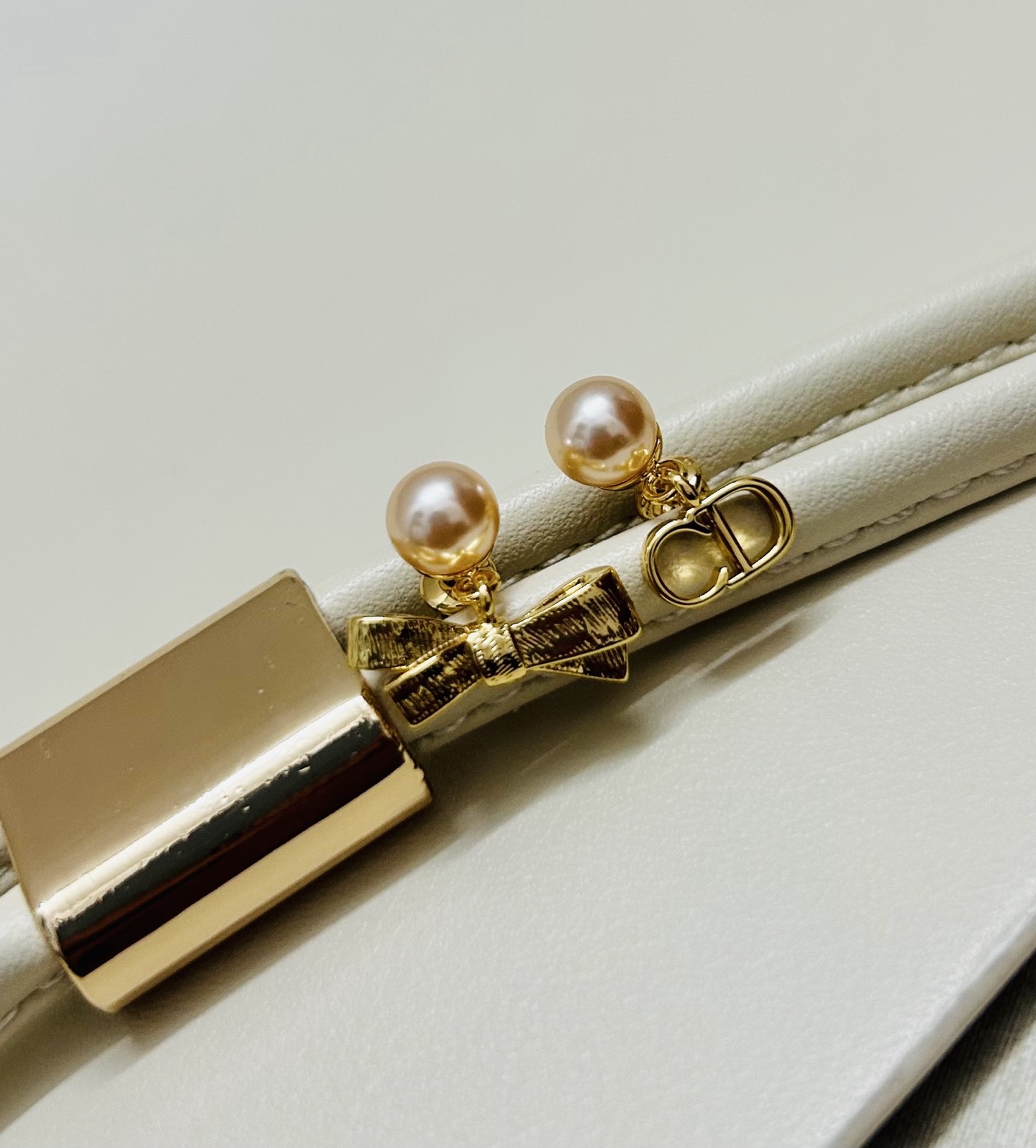 Dior CD Bow earrings Gold-tone metal with champagne pink pearl resin beads One Size