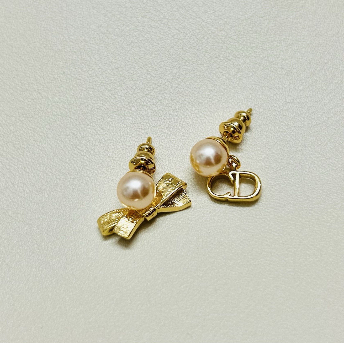 Dior CD Bow earrings Gold-tone metal with champagne pink pearl resin beads One Size