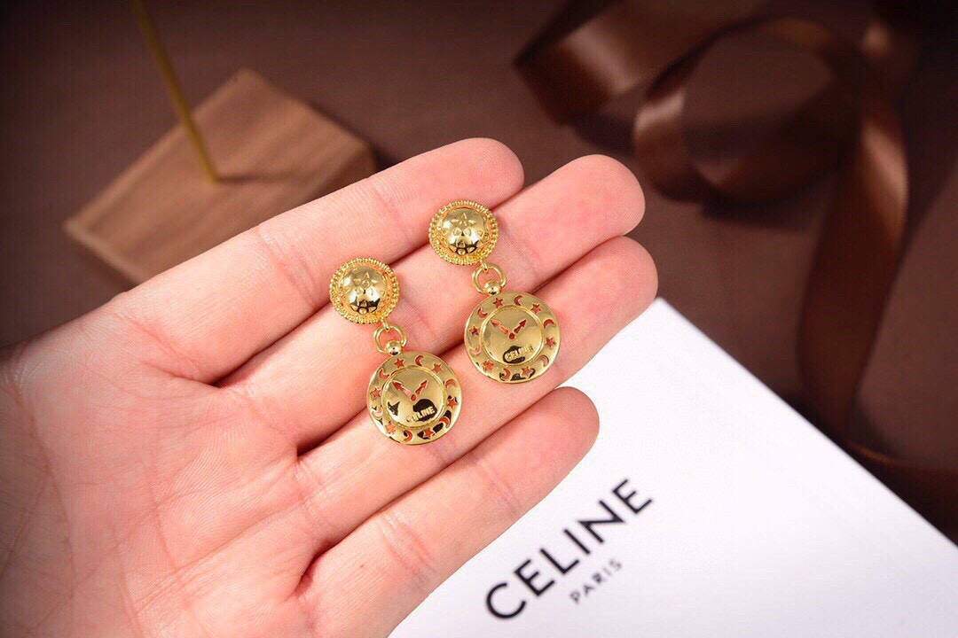 Celine Celestial Clock Drop Earrings earrings gold-tone metal with black and orange enamel star and moon detailing 2 5cm drop length