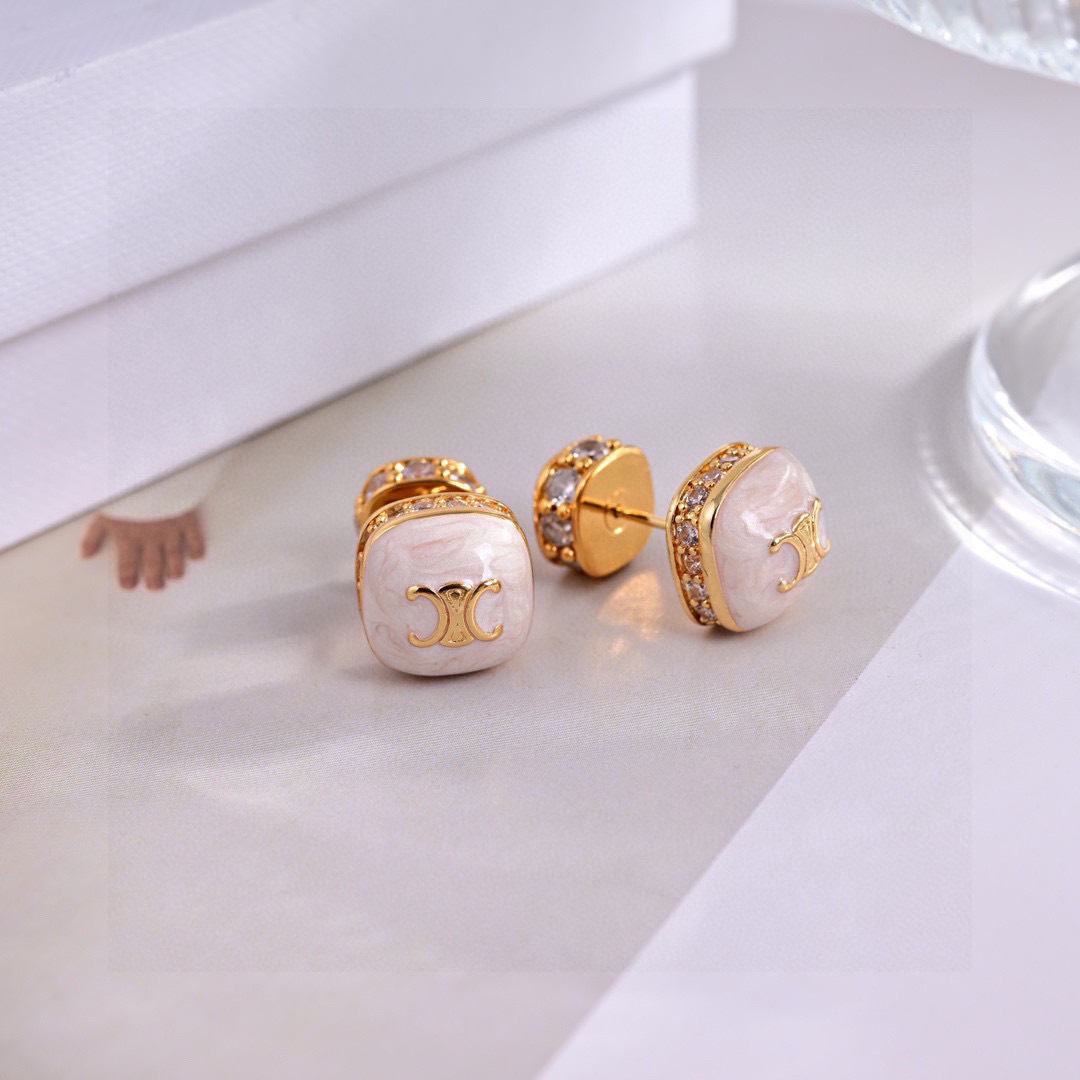 Celine Triomphe Square Stud Earrings earrings Gold-tone metal with clear cubic zirconia accents available in black enamel and white mother-of-pearl face options with gold Triomphe logo 1cm stud diameter