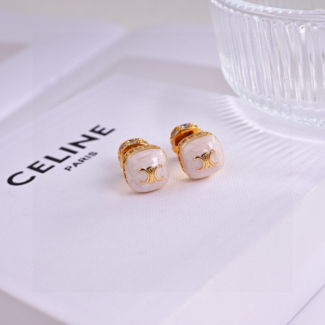Celine Triomphe Square Stud Earrings earrings Gold-tone metal with clear cubic zirconia accents available in black enamel and white mother-of-pearl face options with gold Triomphe logo 1cm stud diameter