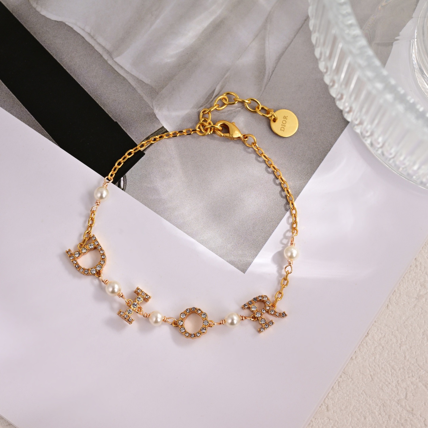 Dior Dio r evolution bracelet gold-tone metal clear crystal white faux pearl 17cm