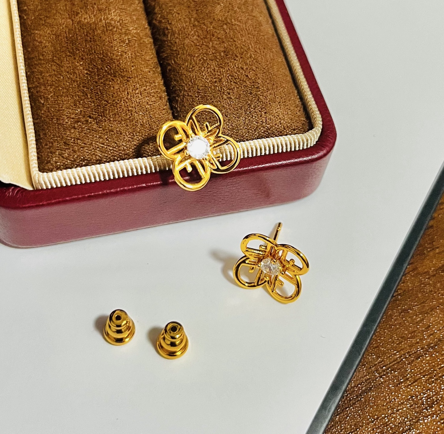 Fendi FF Logo Flower Stud Earrings earrings gold-tone metal with clear faceted center stone 10mm stud diameter