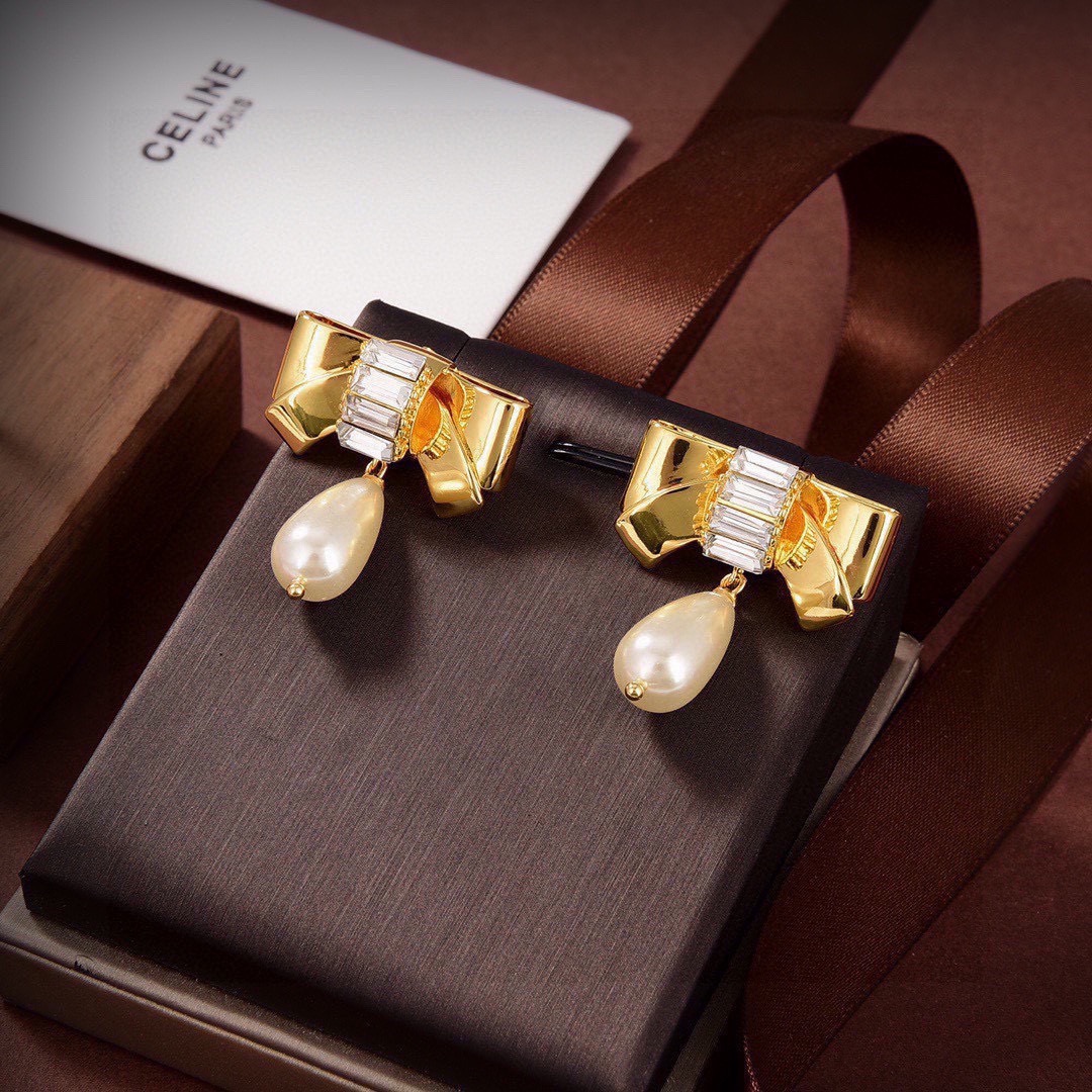 Celine Bow Pearl Drop earrings gold-tone metal clear baguette-cut crystals cream teardrop faux pearl 3 2cm drop length