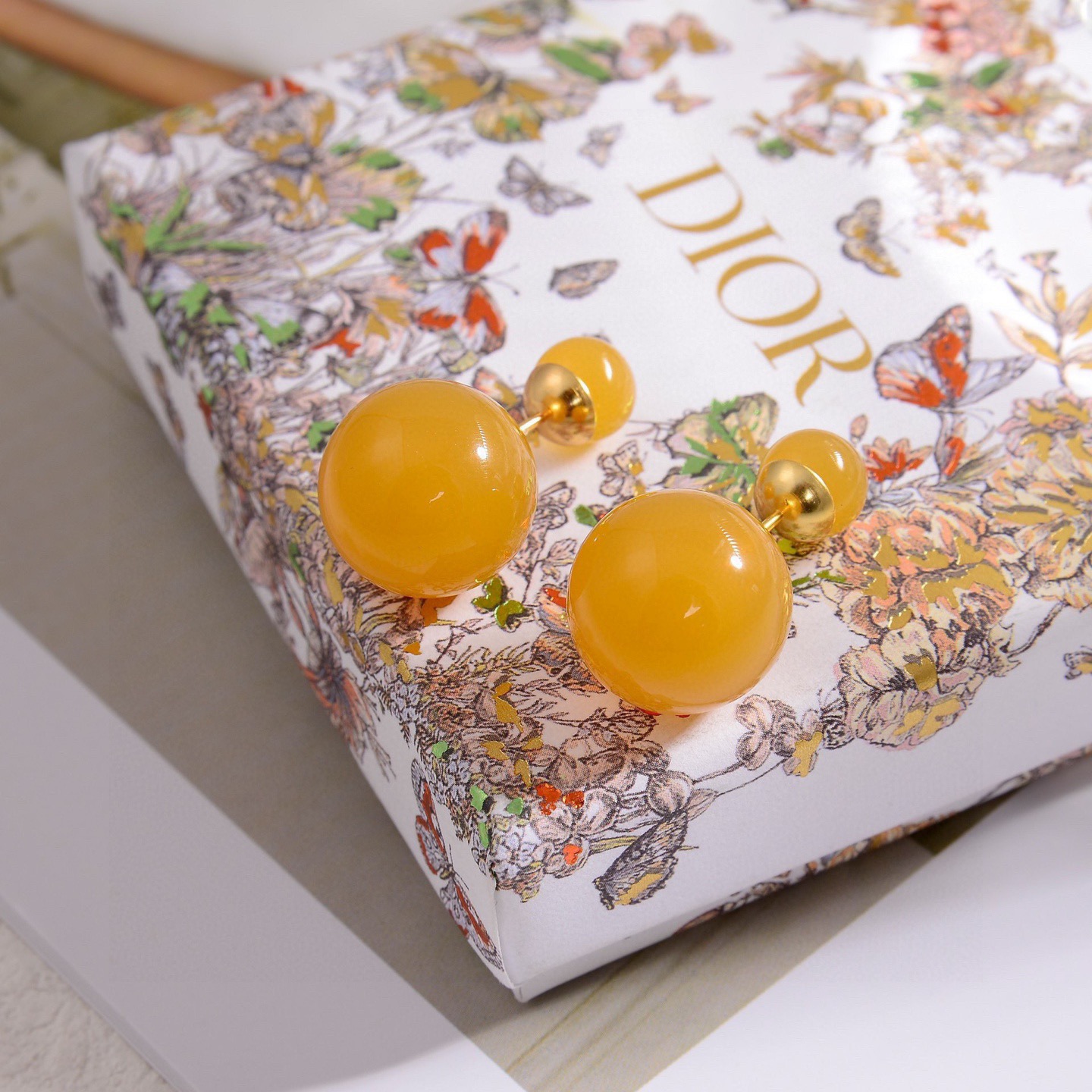 Dior Tribales earrings gold-tone metal honey yellow resin beads 16mm large bead 8mm small