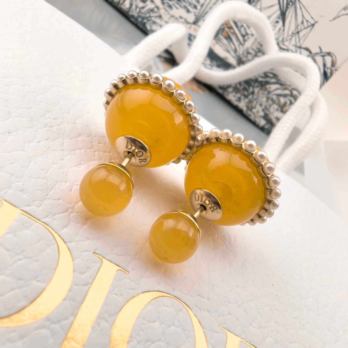 Dior Tribales earrings gold-tone metal yellow resin white faux pearl 2cm front bead diameter