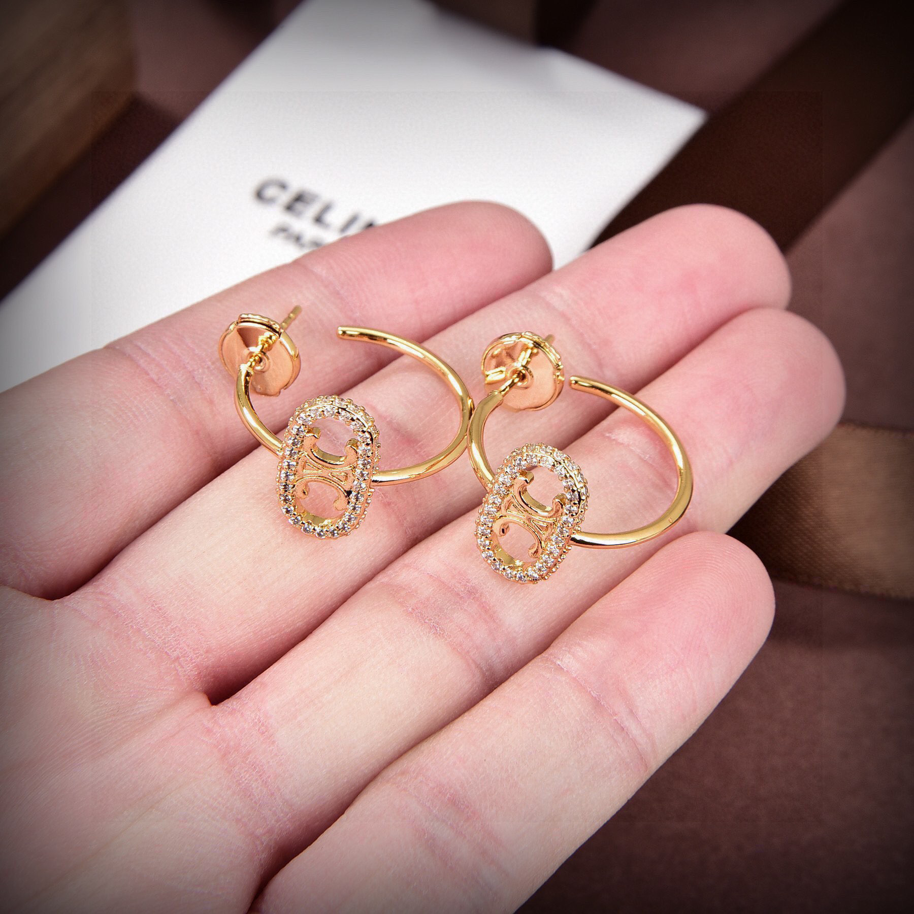 Celine Maillon Triomphe earrings gold-tone metal with clear diamond-like accent stones 1 5cm hoop diameter