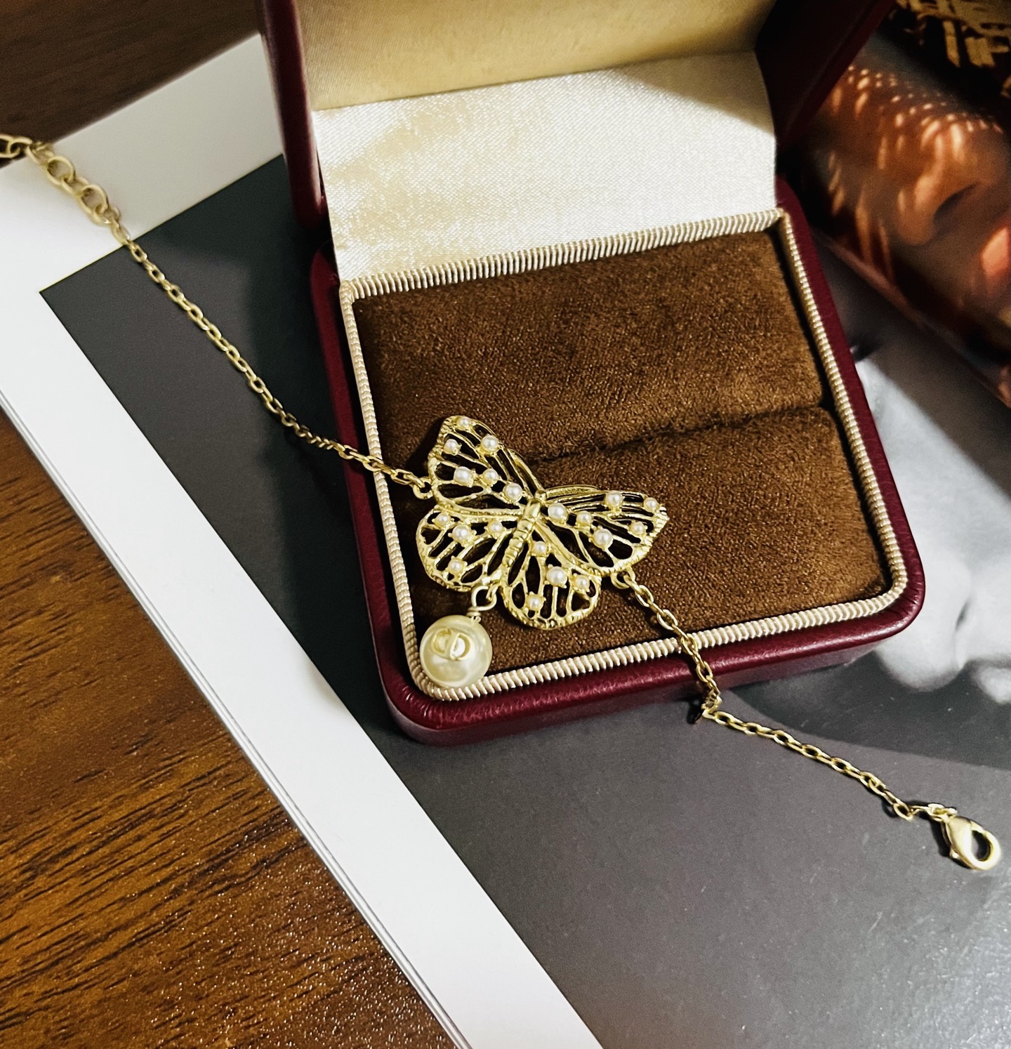 Dior Toile de Jouy Papillon bracelet matte gold metal with white resin pearl accents 16cm with 3cm extender chain