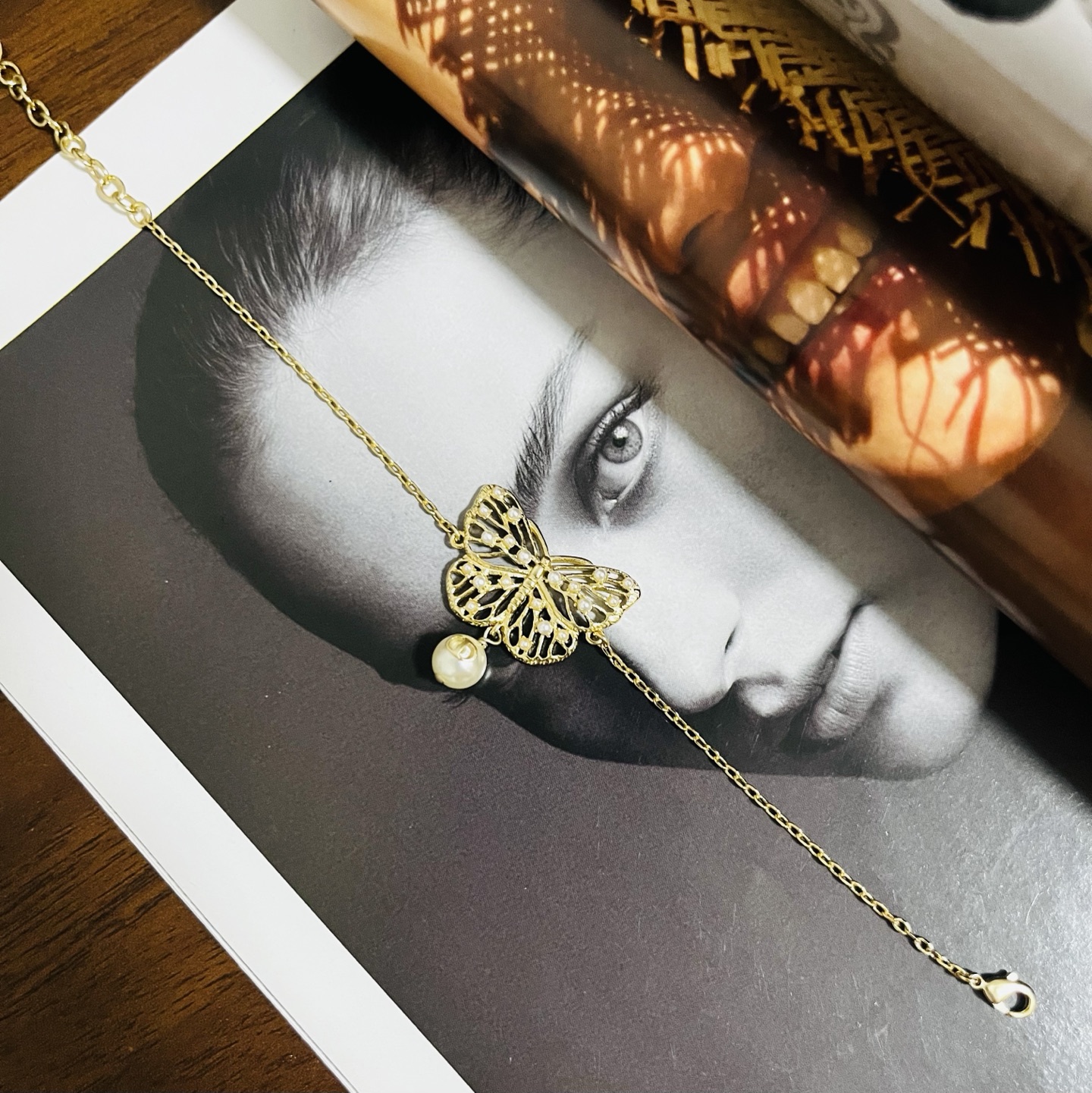 Dior Toile de Jouy Papillon bracelet matte gold metal with white resin pearl accents 16cm with 3cm extender chain