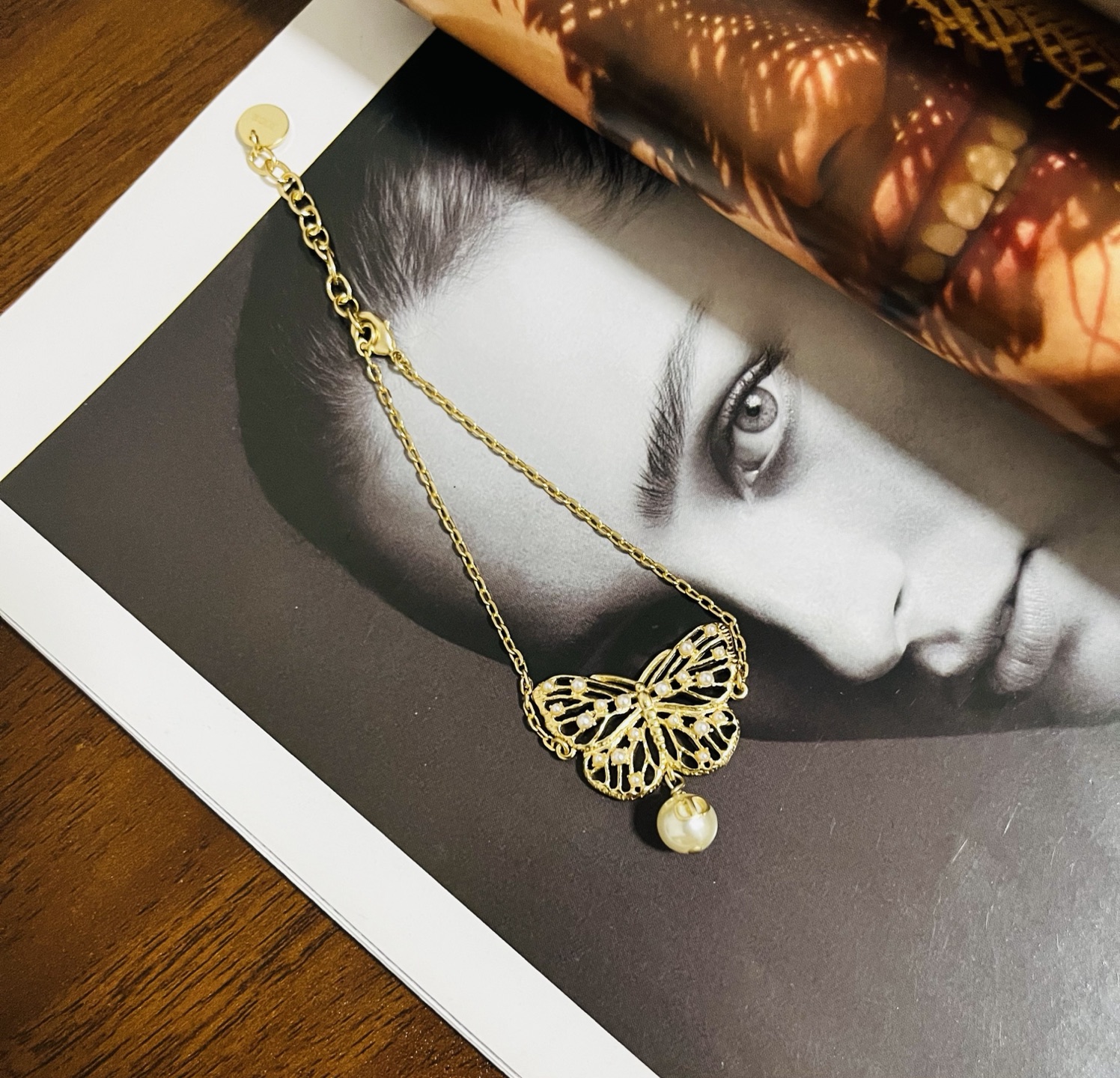 Dior Toile de Jouy Papillon bracelet matte gold metal with white resin pearl accents 16cm with 3cm extender chain
