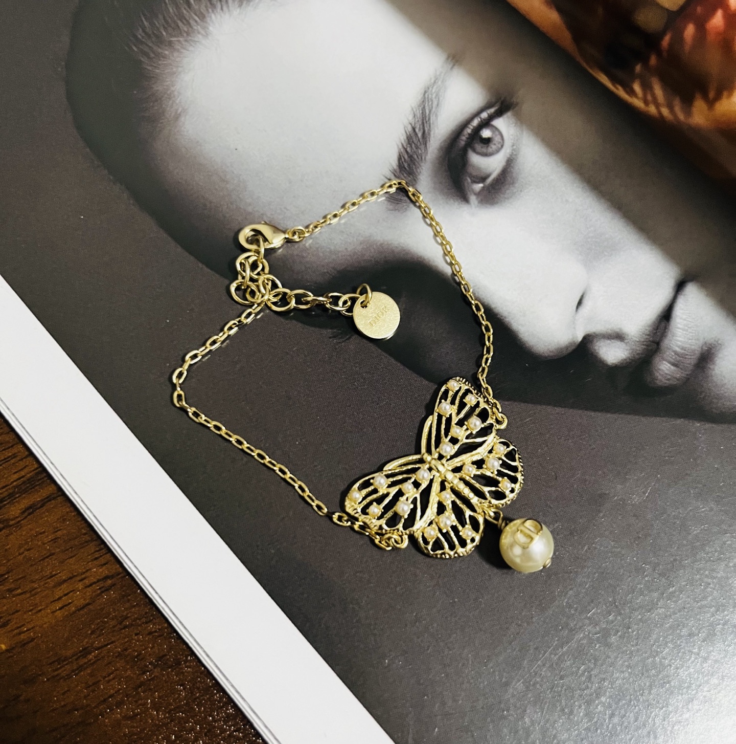 Dior Toile de Jouy Papillon bracelet matte gold metal with white resin pearl accents 16cm with 3cm extender chain