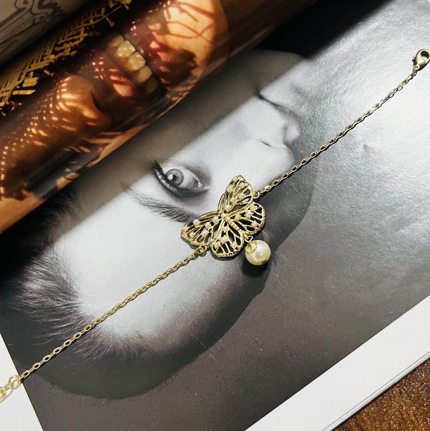 Dior Toile de Jouy Papillon bracelet matte gold metal with white resin pearl accents 16cm with 3cm extender chain