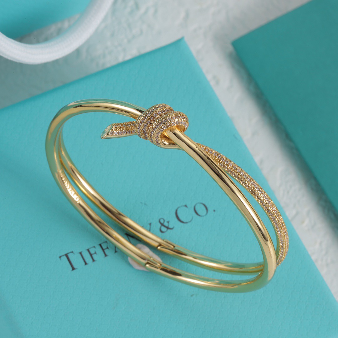 Tiffany Co Fate Knot bracelet Available in 18k white gold 18k yellow gold 18k rose gold all set with pave-set clear diamonds 17cm inner circumference