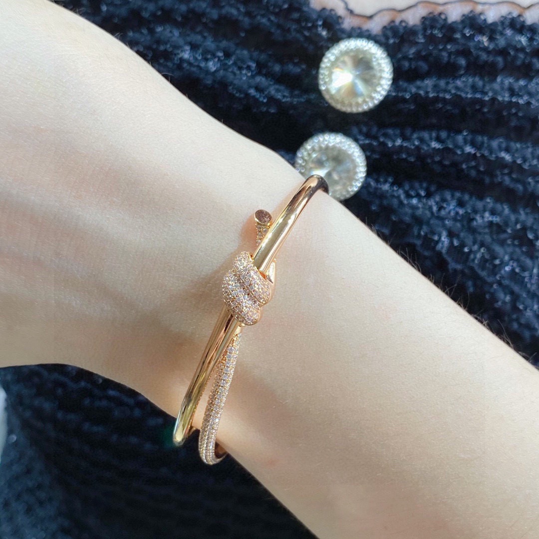 Tiffany Co Fate Knot bracelet Available in 18k white gold 18k yellow gold 18k rose gold all set with pave-set clear diamonds 17cm inner circumference