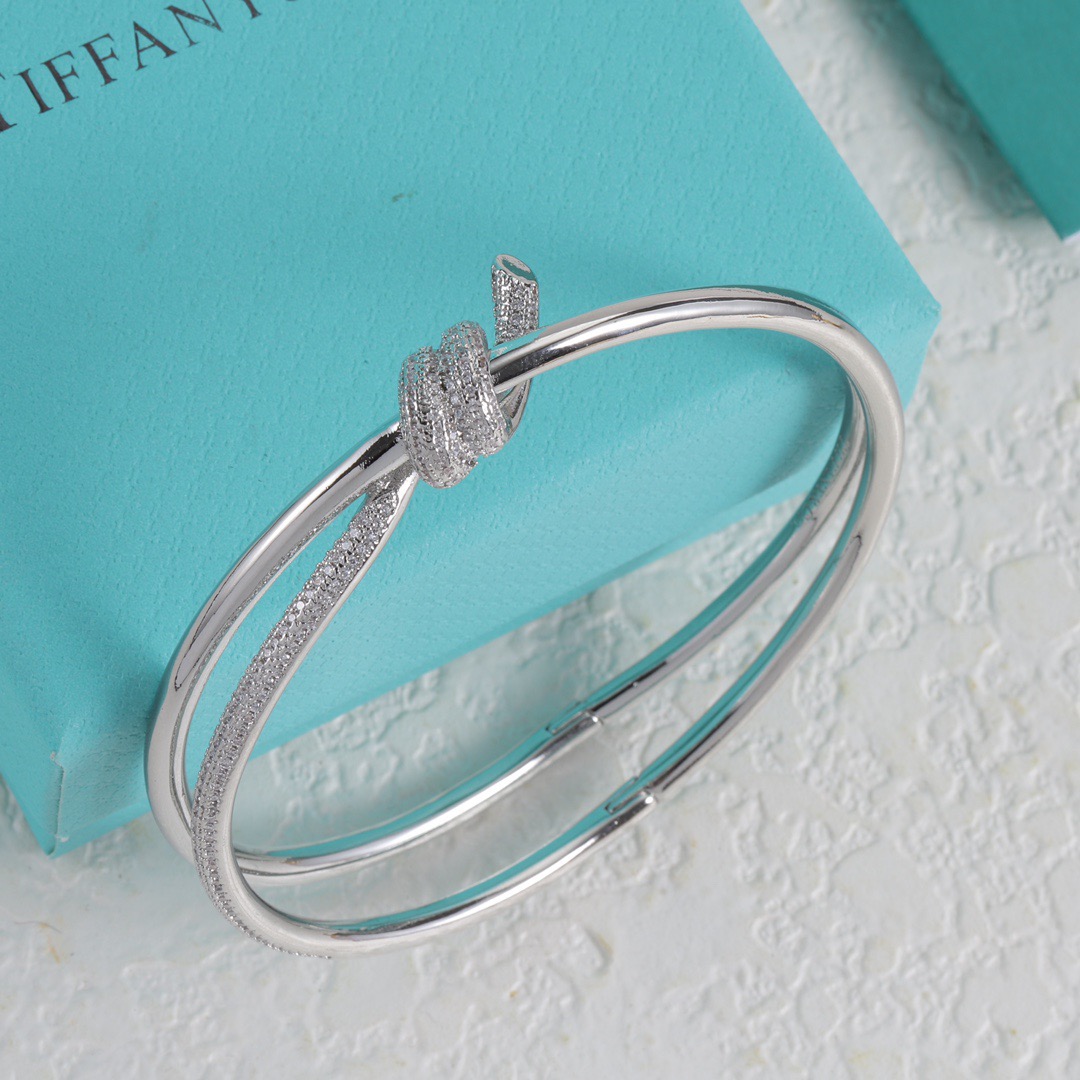 Tiffany Co Fate Knot bracelet Available in 18k white gold 18k yellow gold 18k rose gold all set with pave-set clear diamonds 17cm inner circumference