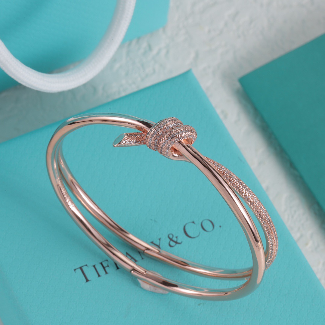 Tiffany Co Fate Knot bracelet Available in 18k white gold 18k yellow gold 18k rose gold all set with pave-set clear diamonds 17cm inner circumference