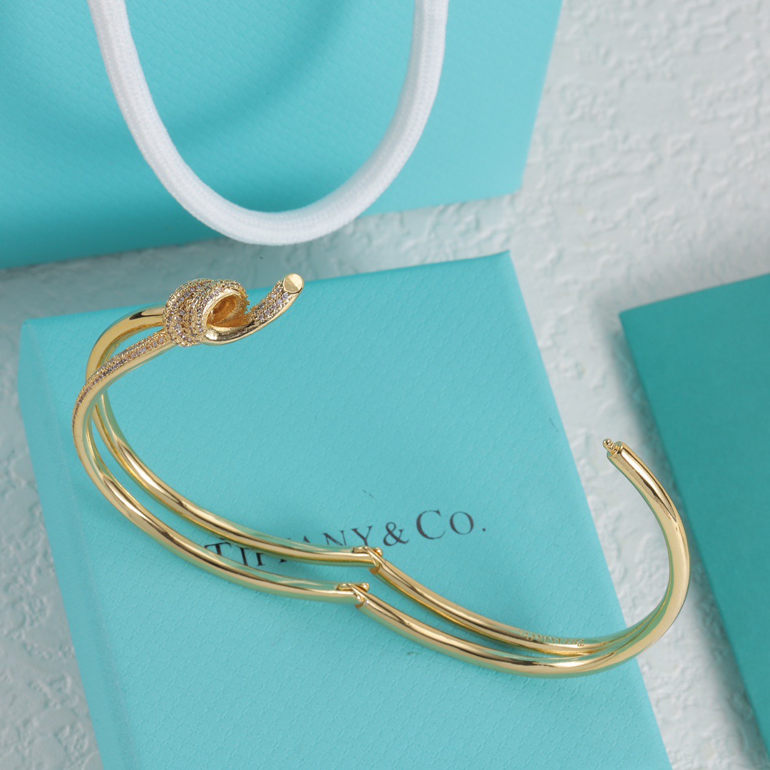 Tiffany Co Fate Knot bracelet Available in 18k white gold 18k yellow gold 18k rose gold all set with pave-set clear diamonds 17cm inner circumference