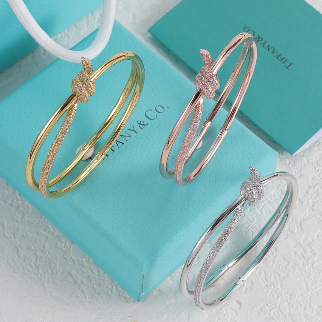 Tiffany Co Fate Knot bracelet Available in 18k white gold 18k yellow gold 18k rose gold all set with pave-set clear diamonds 17cm inner circumference