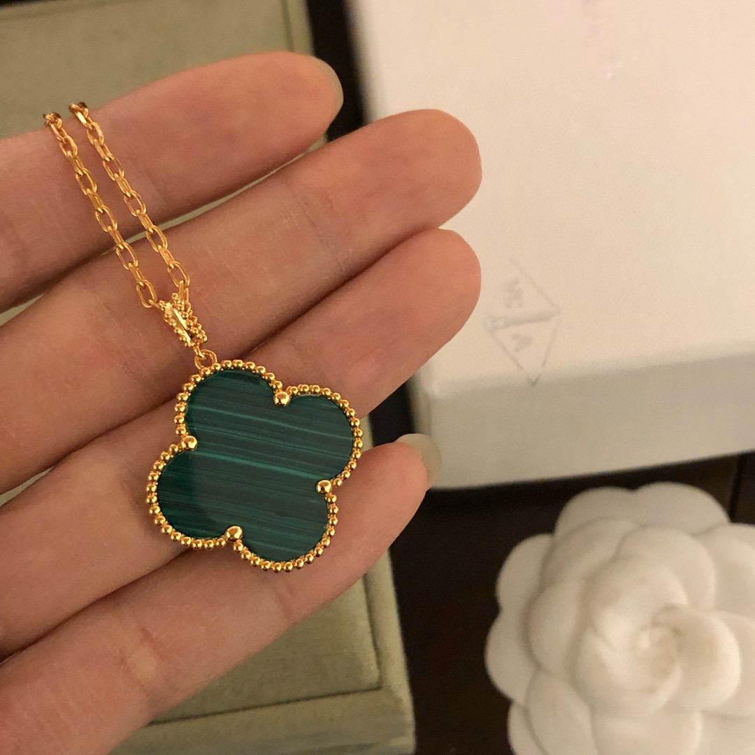 Van Cleef Arpels Magic Alhambra necklace 18k yellow gold with carnelian and malachite clover motifs 25mm pendant