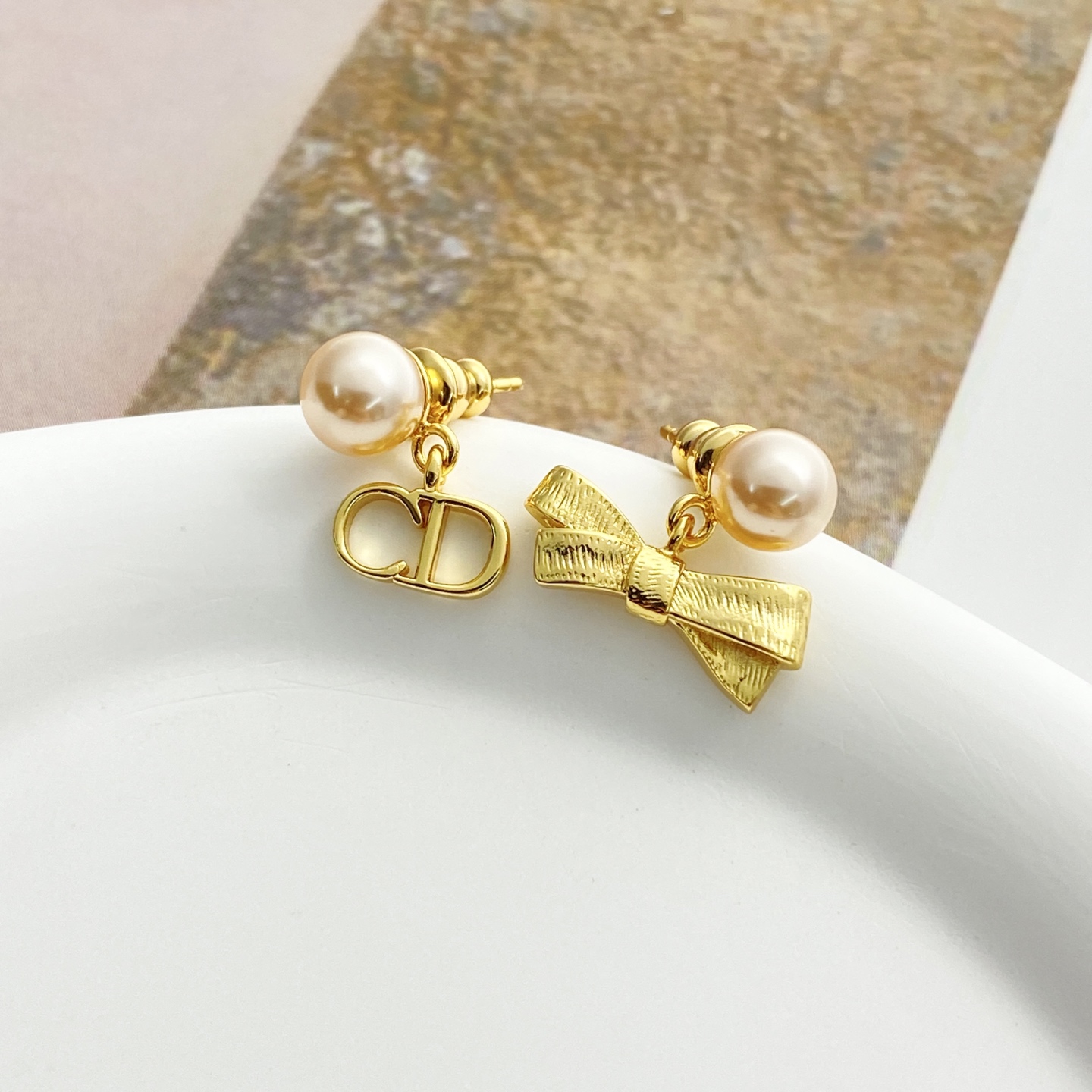 Dior Tribales CD Bow Pearl Earrings earrings Gold-tone metal with cream white faux pearls One Size post length 1cm drop length 1 5cm
