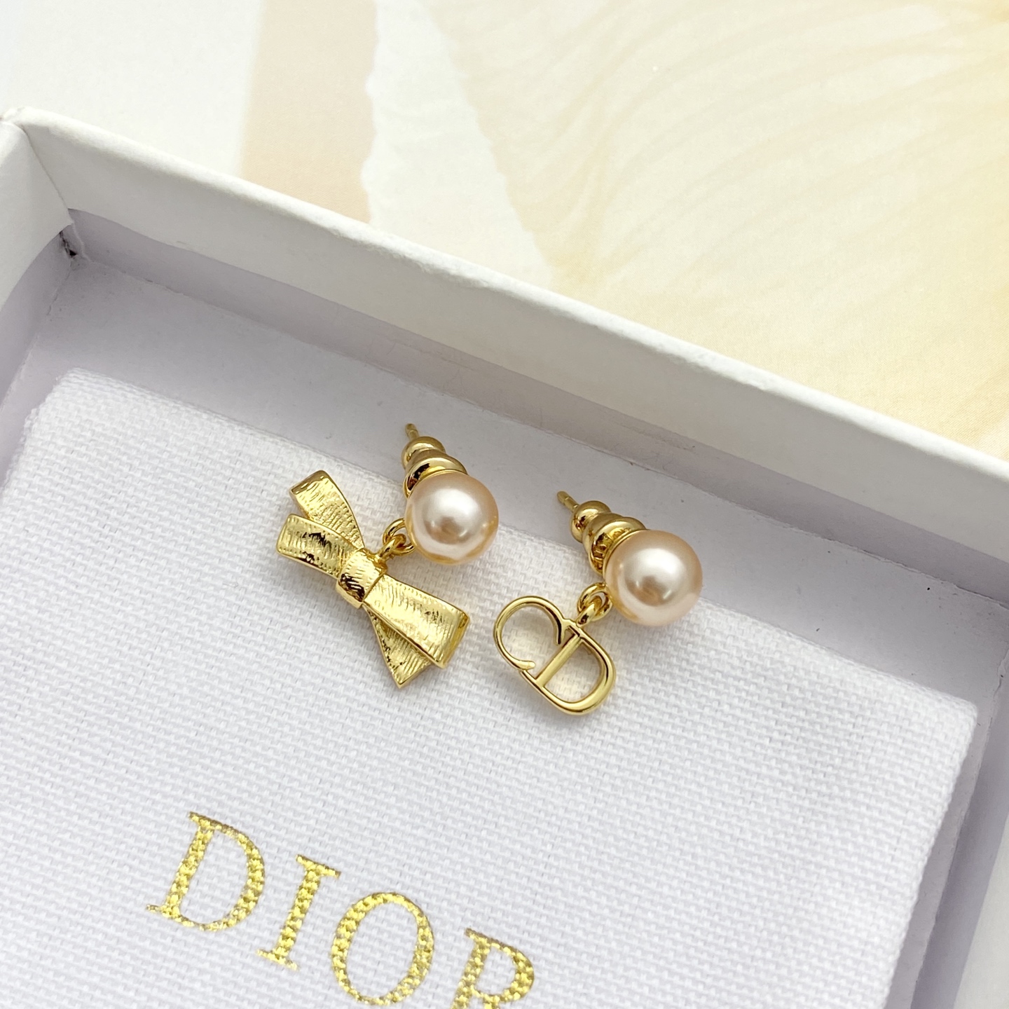 Dior Tribales CD Bow Pearl Earrings earrings Gold-tone metal with cream white faux pearls One Size post length 1cm drop length 1 5cm