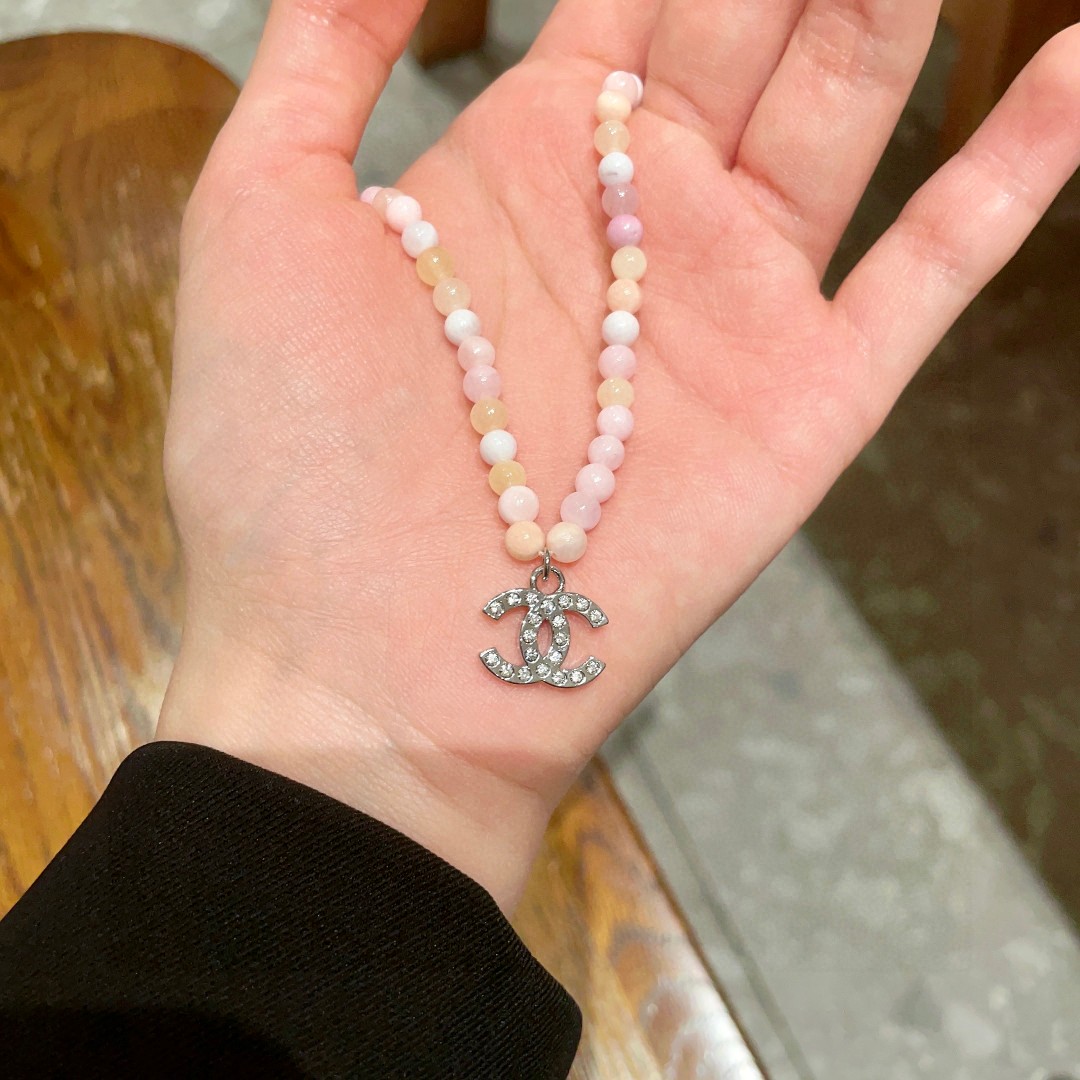 Chanel CC Logo Pastel Bead Choker necklace Silver-tone metal with clear crystal accents pastel pink cream pale yellow and white beaded chain 40cm with 5cm extender