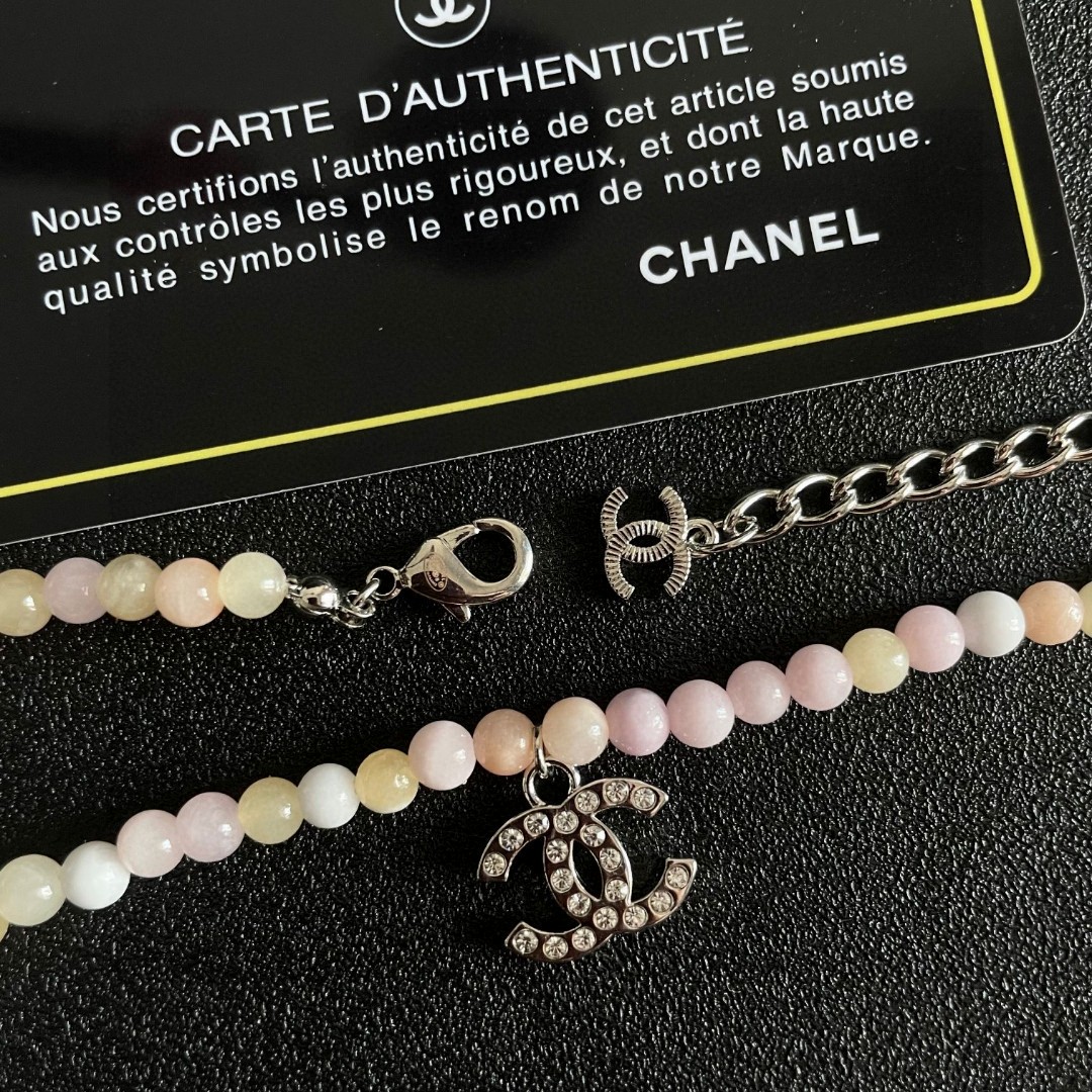 Chanel CC Logo Pastel Bead Choker necklace Silver-tone metal with clear crystal accents pastel pink cream pale yellow and white beaded chain 40cm with 5cm extender