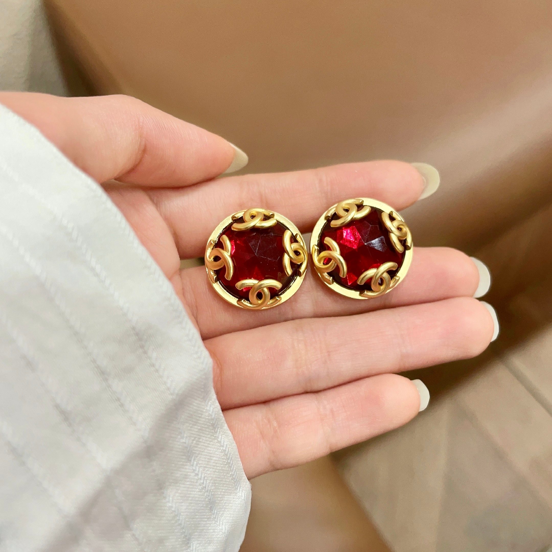 Chanel CC Logo Faceted Stone Stud Earrings earrings Gold-tone metal with deep red faceted resin stone 2cm diameter
