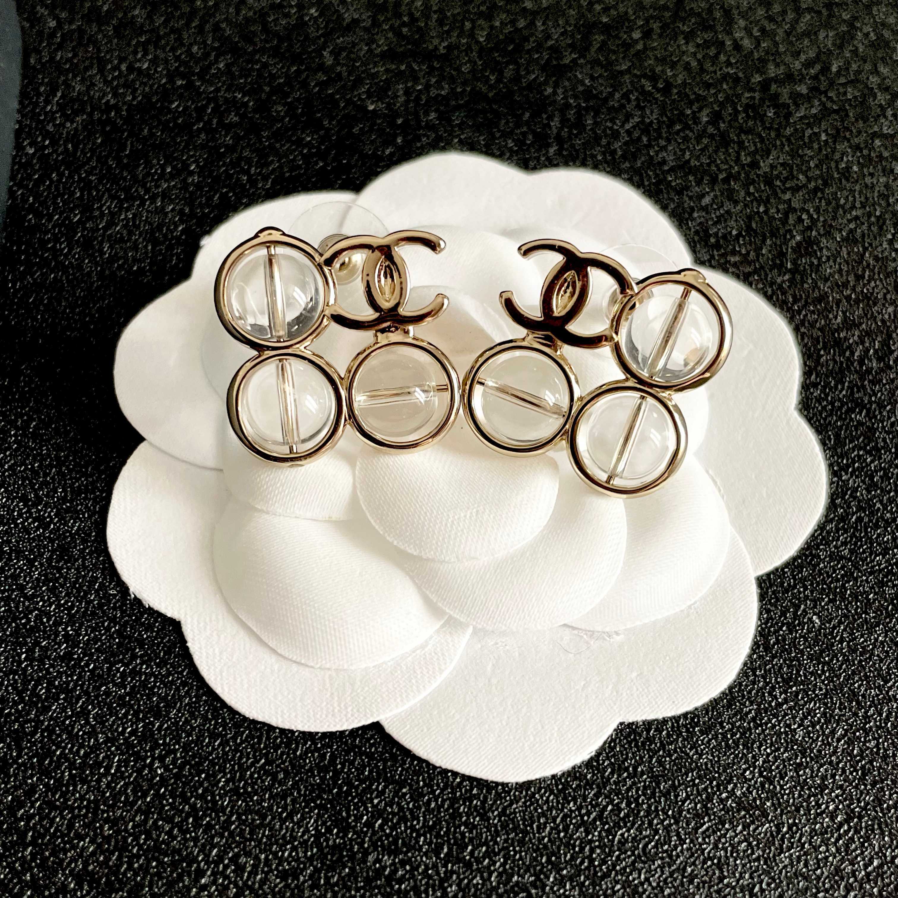 Chanel CC Logo Transparent Lucite Circle Stud Earrings earrings light gold tone metal with clear transparent resin stones 1 5cm diameter per earring