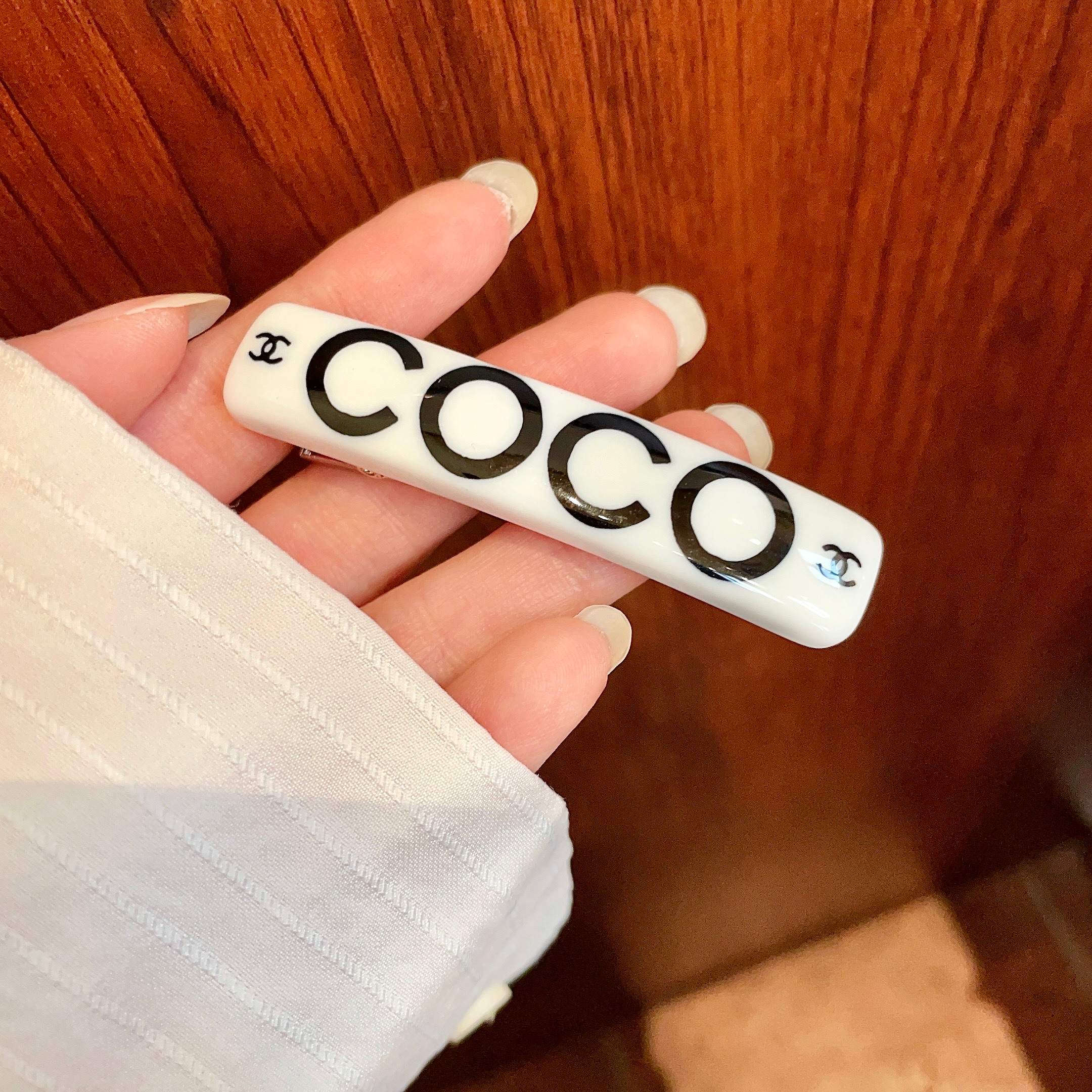 Chanel COCO brooch white base with black printed logos and lettering 6cm