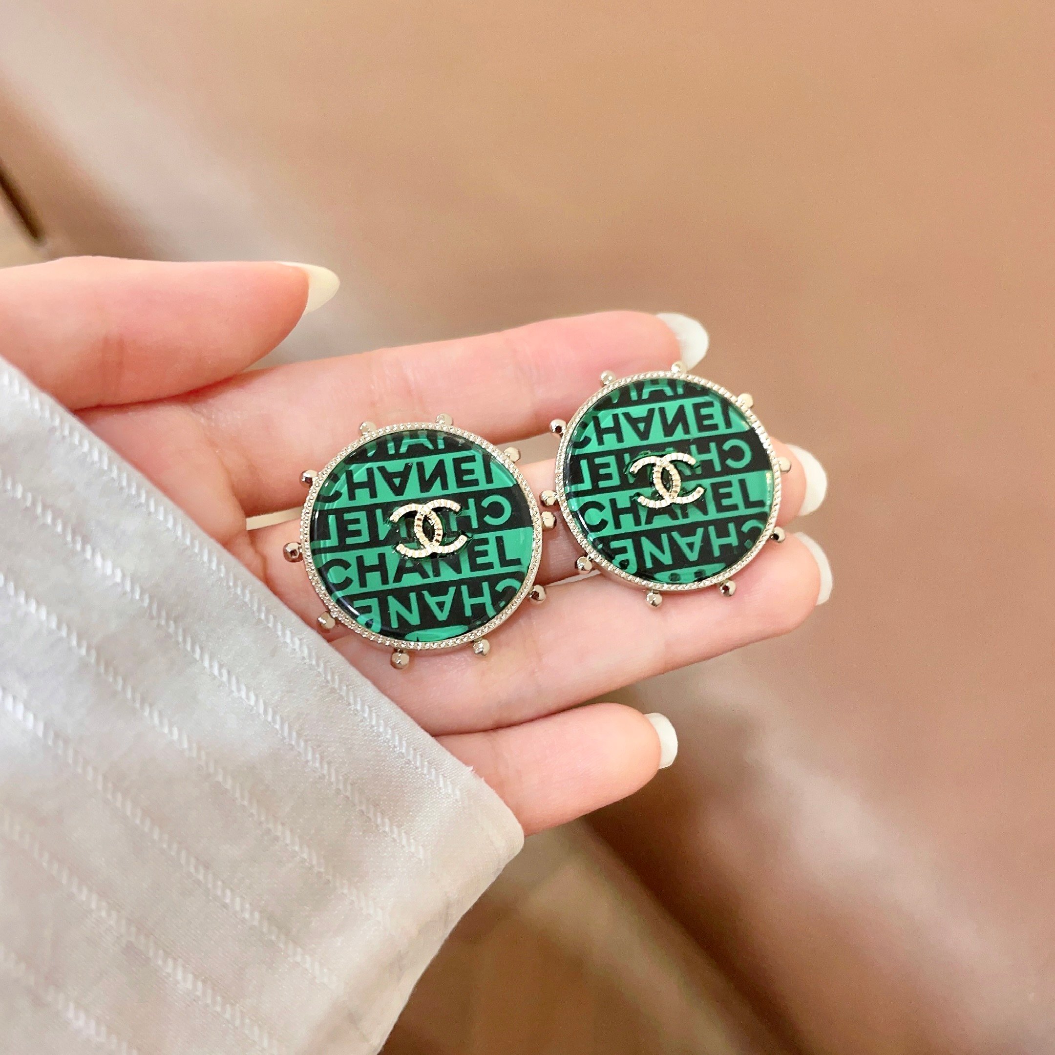 Chanel CC Logo Round Stud Earrings earrings Gold-tone metal with green and black enamel clear crystal accents 2 5cm diameter