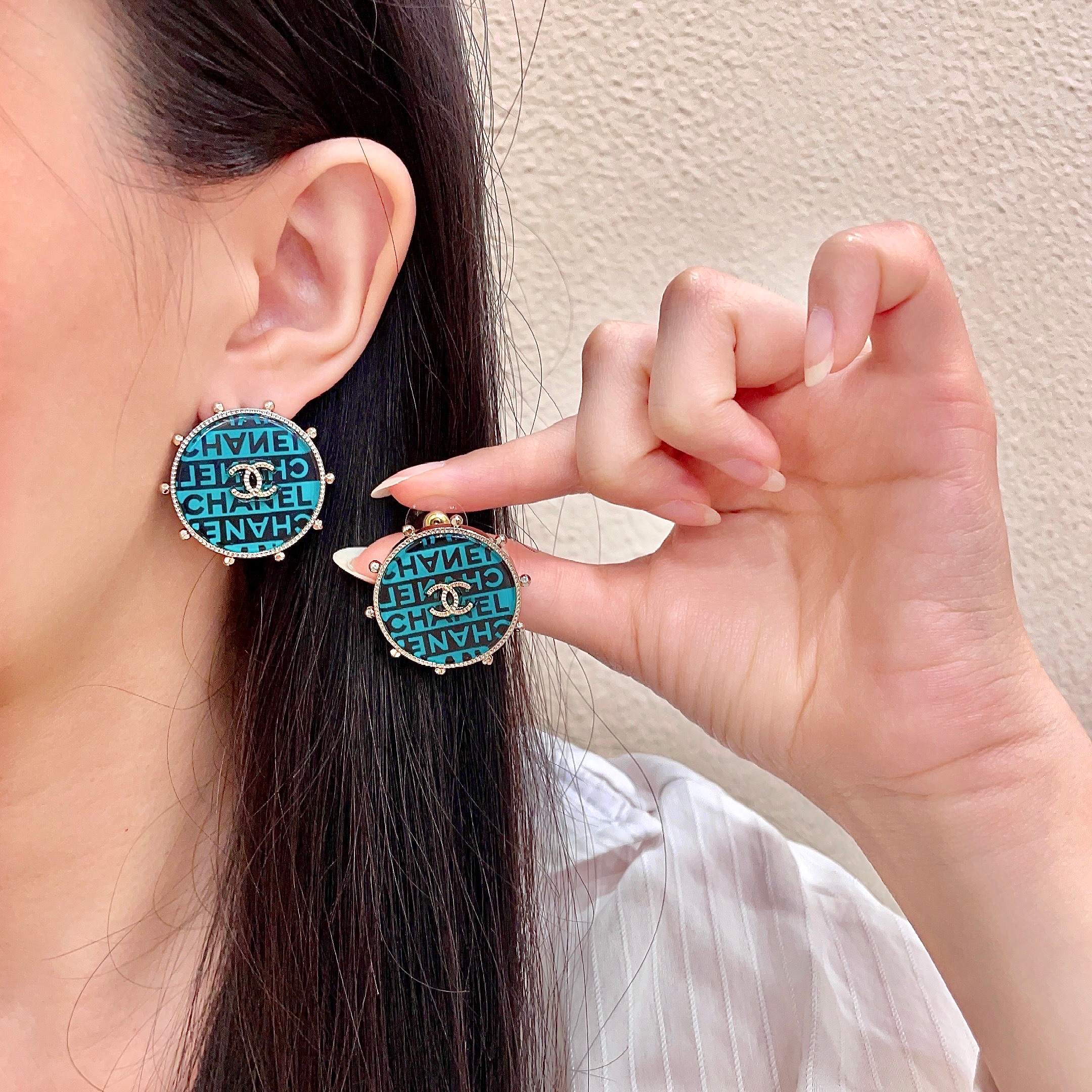 Chanel CC Logo Round Stud Earrings earrings Light gold-tone metal with turquoise and black enamel crystal-embellished interlocking CC logo 2 5cm diameter