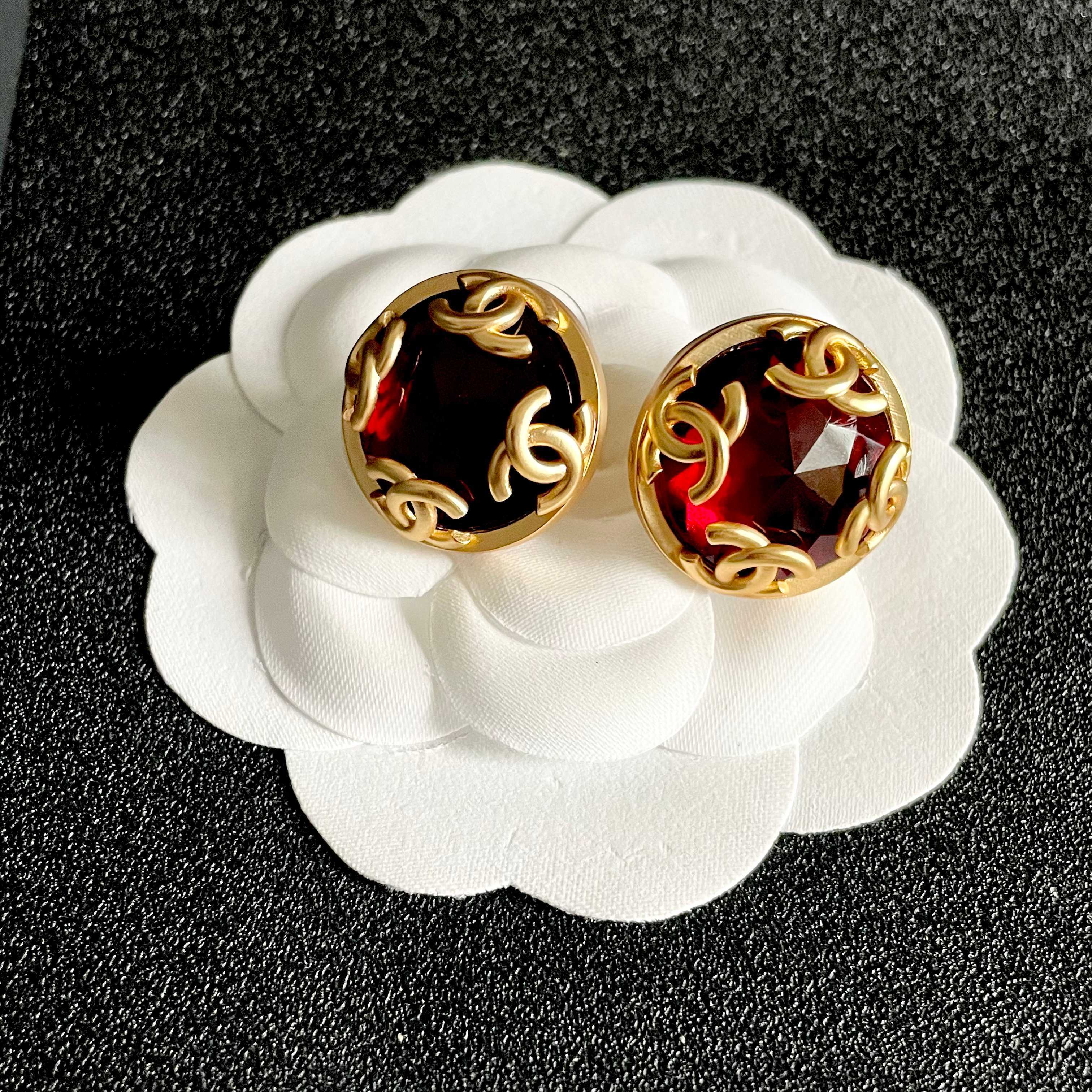 Chanel CC Logo Faceted Stone Stud Earrings earrings Gold-tone metal with deep red faceted resin stone 2cm diameter