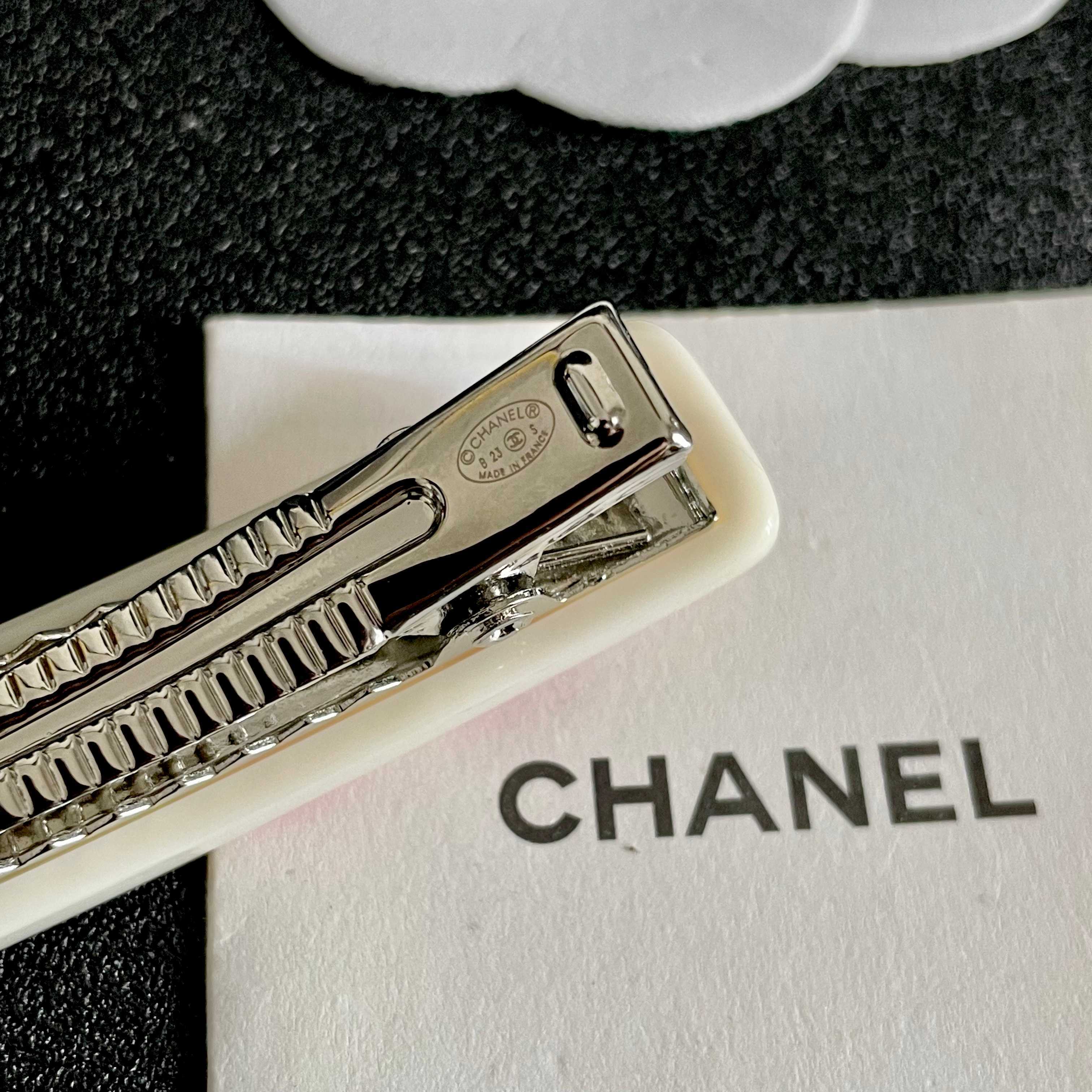 Chanel COCO brooch white base with red printed logos and text 6cm