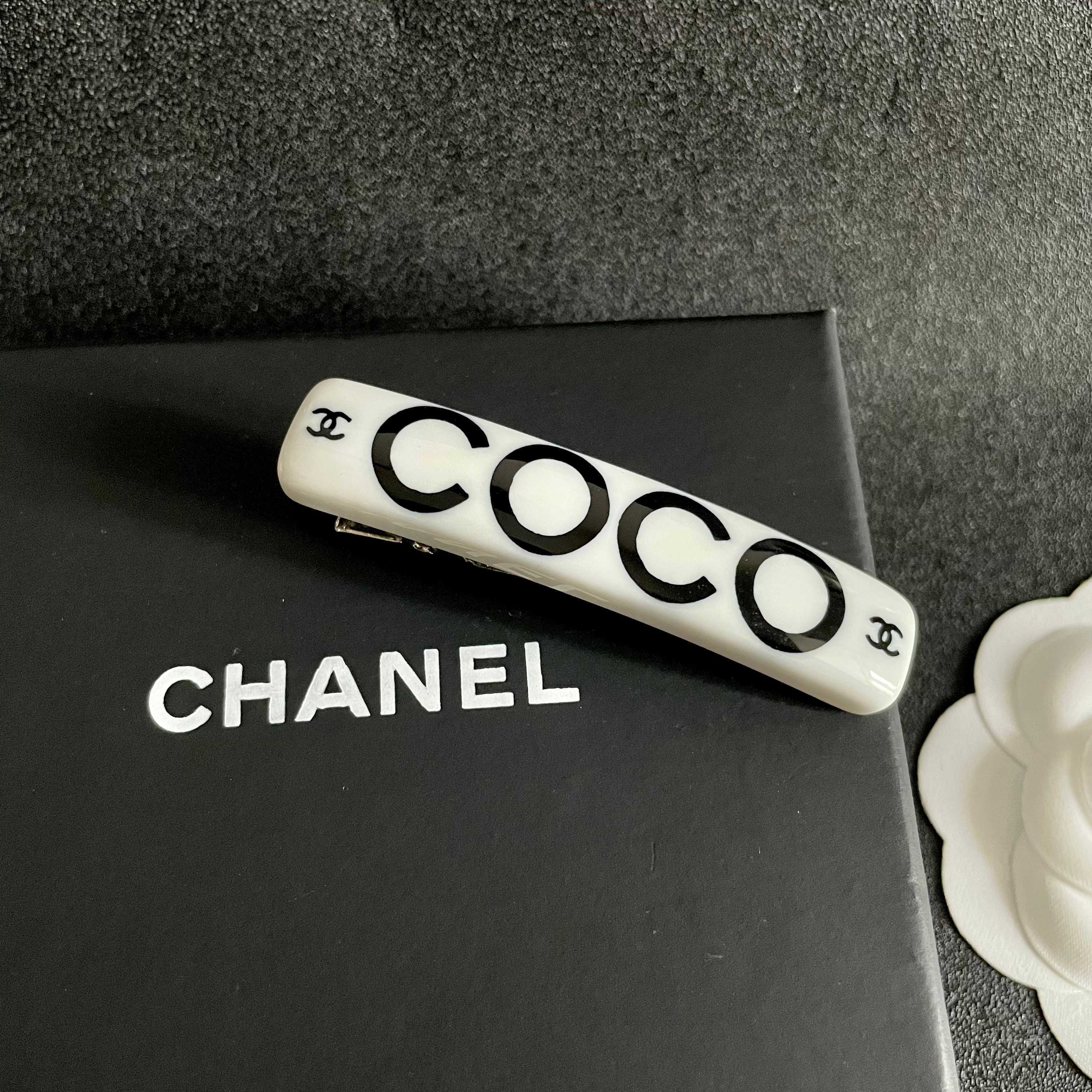 Chanel COCO brooch white base with black printed logos and lettering 6cm