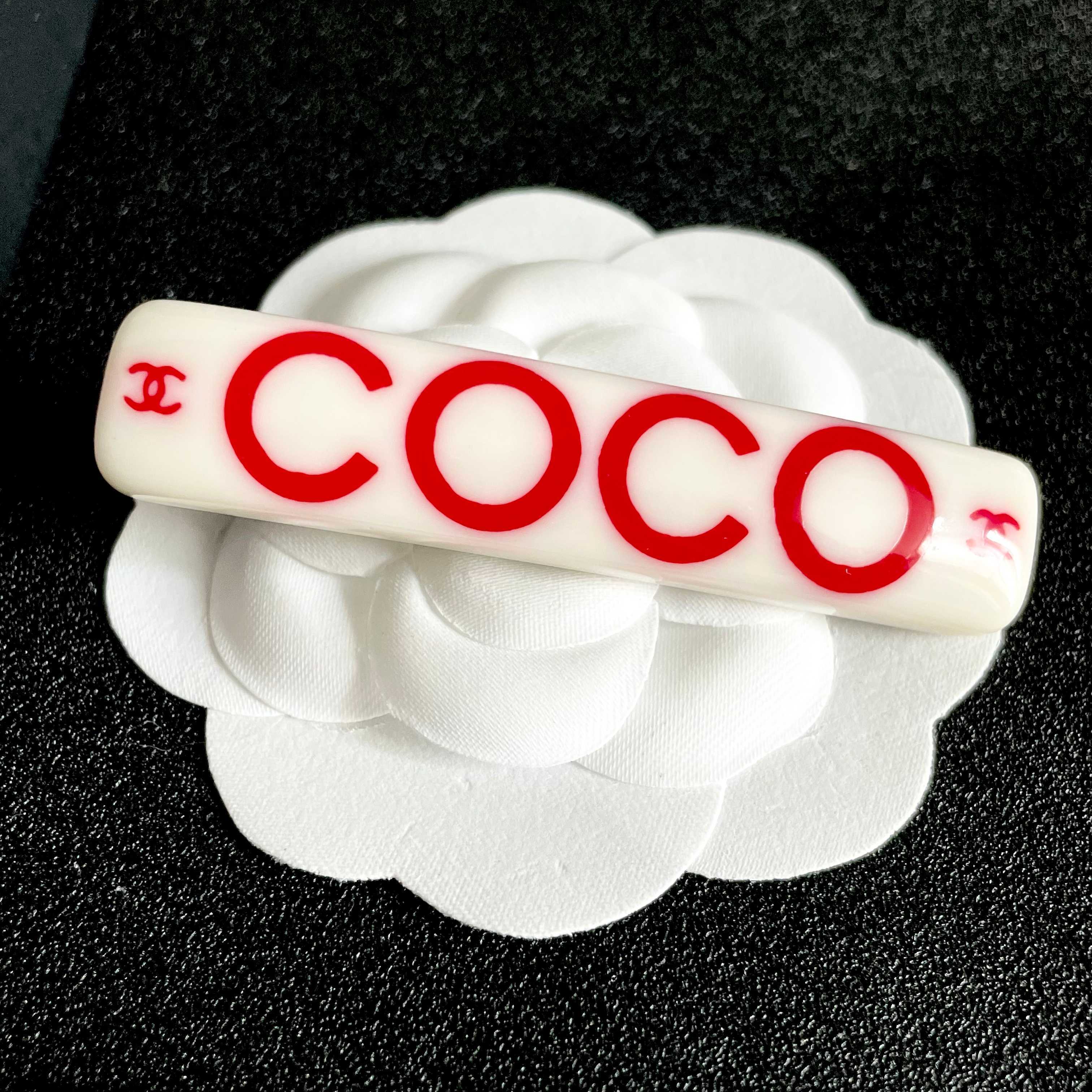 Chanel COCO brooch white base with red printed logos and text 6cm