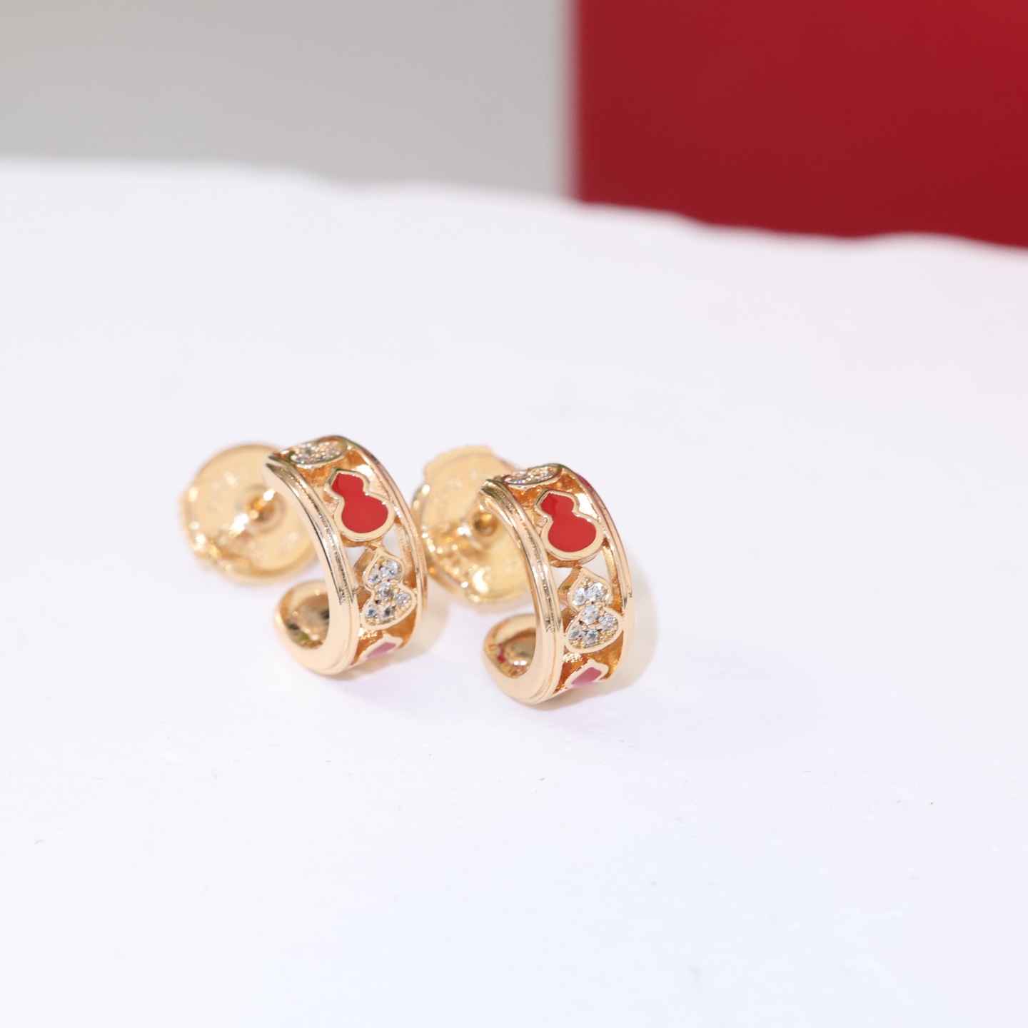 Qeelin Wulu earrings gold-tone metal red enamel clear diamond simulants 10mm hoop diameter
