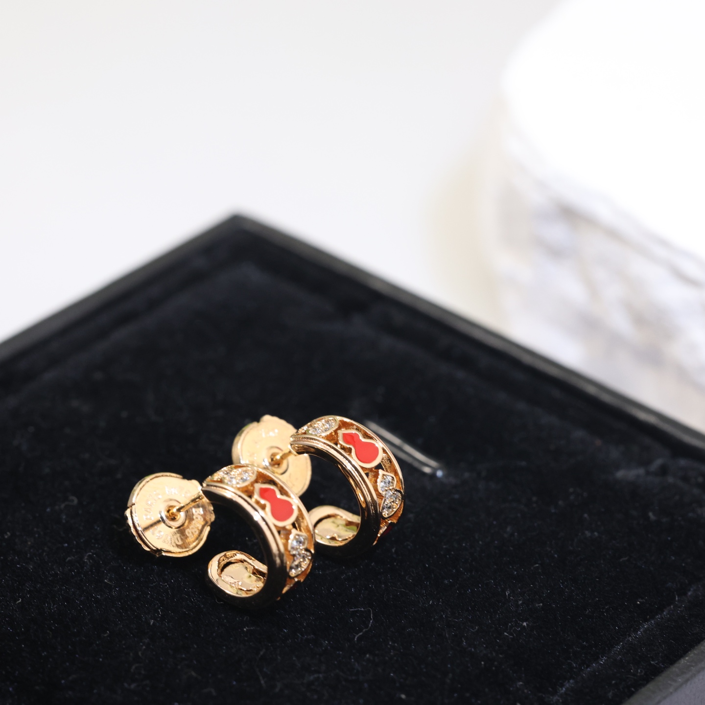 Qeelin Wulu earrings gold-tone metal red enamel clear diamond simulants 10mm hoop diameter