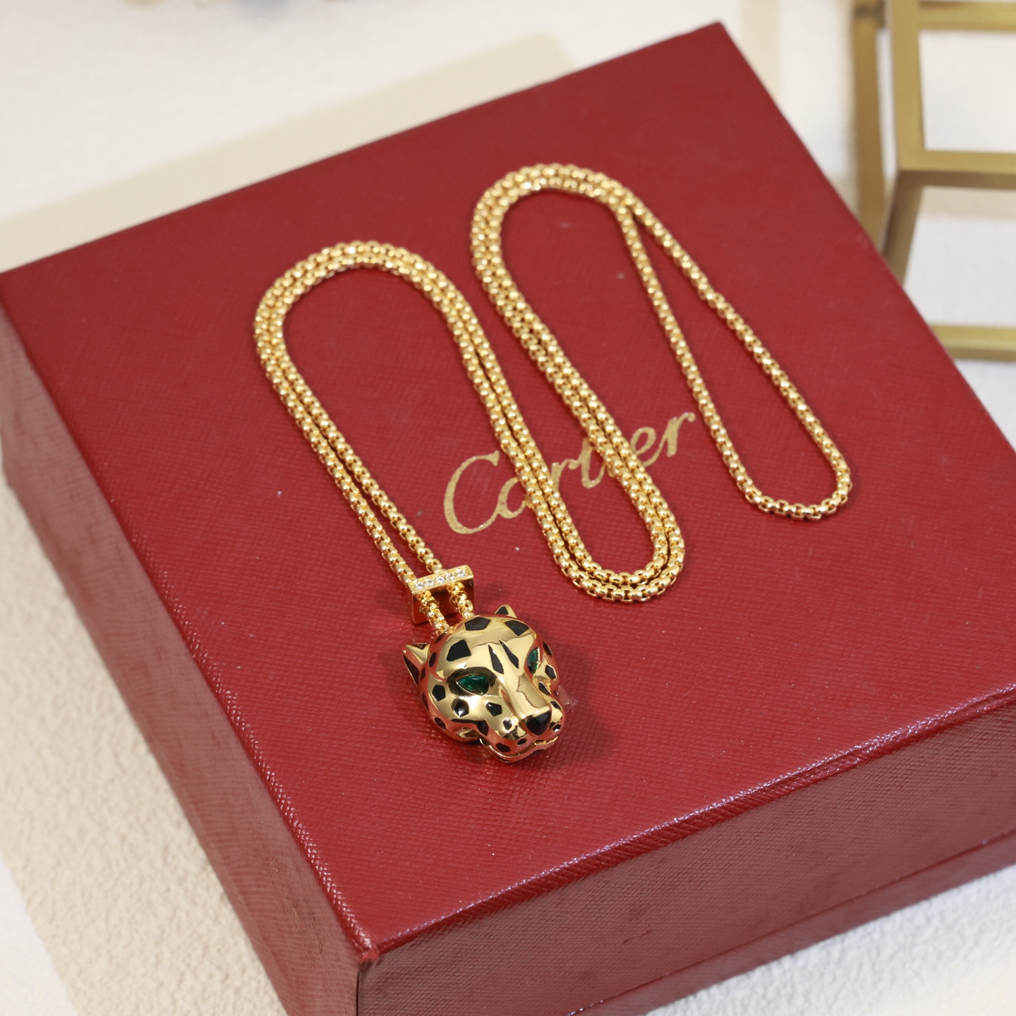 Cartier Panthere de Cartier necklace 18k yellow gold black lacquer green tsavorite garnet diamond accents 42cm