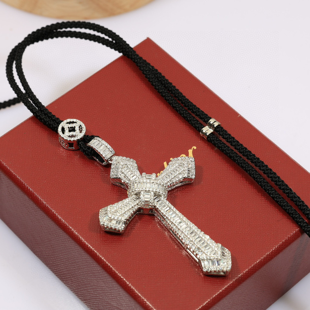 Cartier Diamond Cross Pendant pendant White gold with clear baguette and round diamonds black cord 24 inch black cord chain
